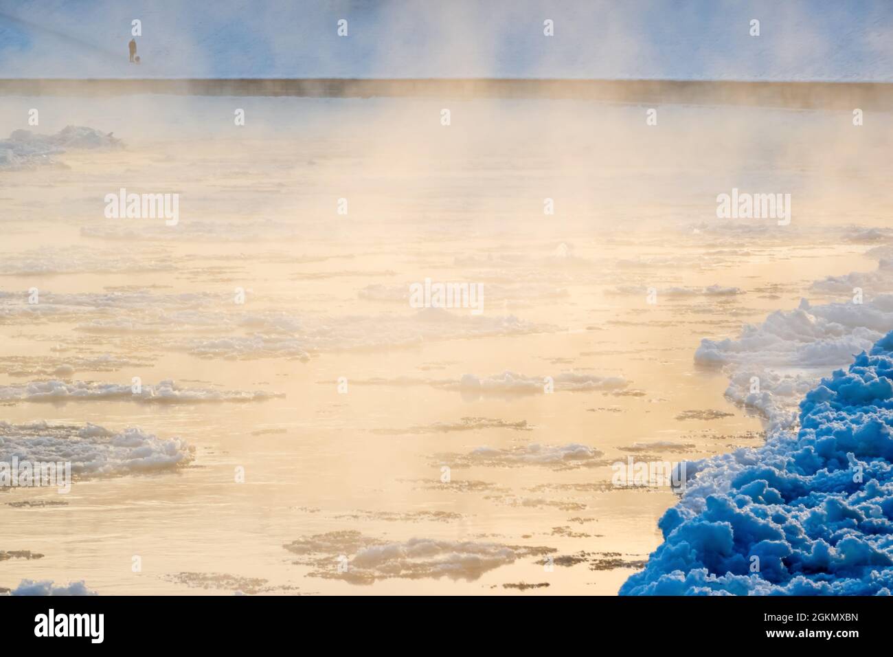 Melting cracked ice flowing down the river on a foggy morning. Misty ...