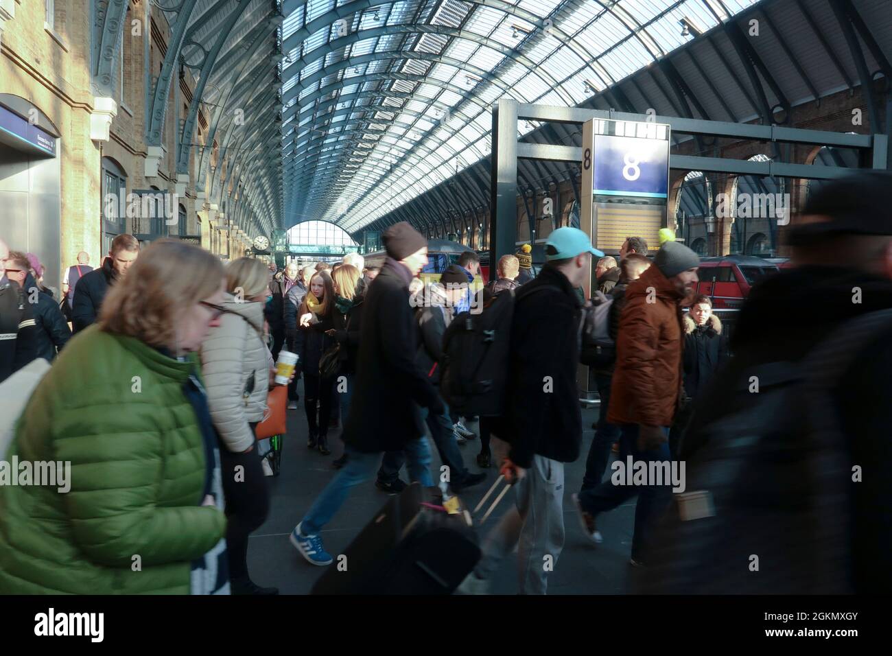 Commuters and tourists at King’s Cross railway station, London Stock Photo