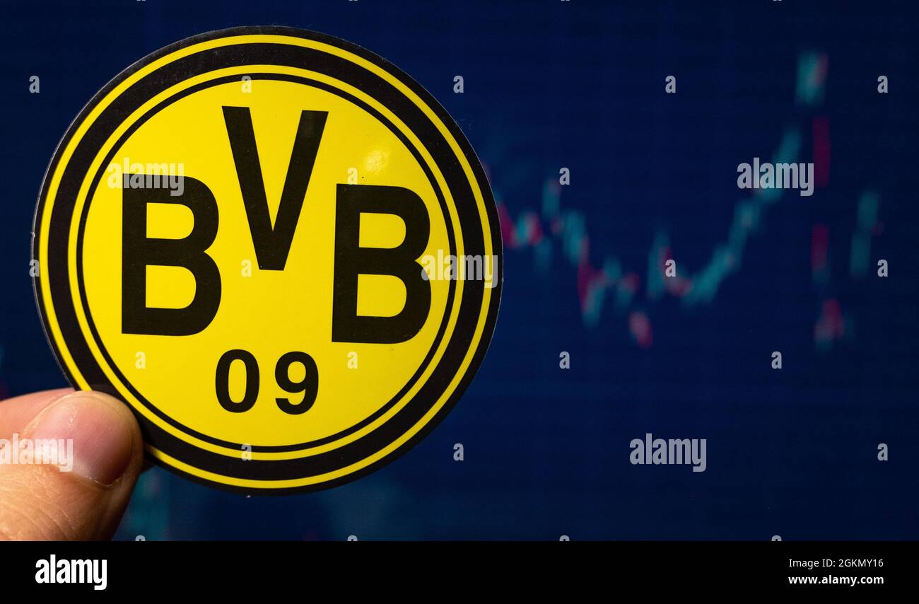 September 1, 2021 Dortmund, Germany. Borussia Dortmund football club emblem against the background of the stock chart. Stock Photo