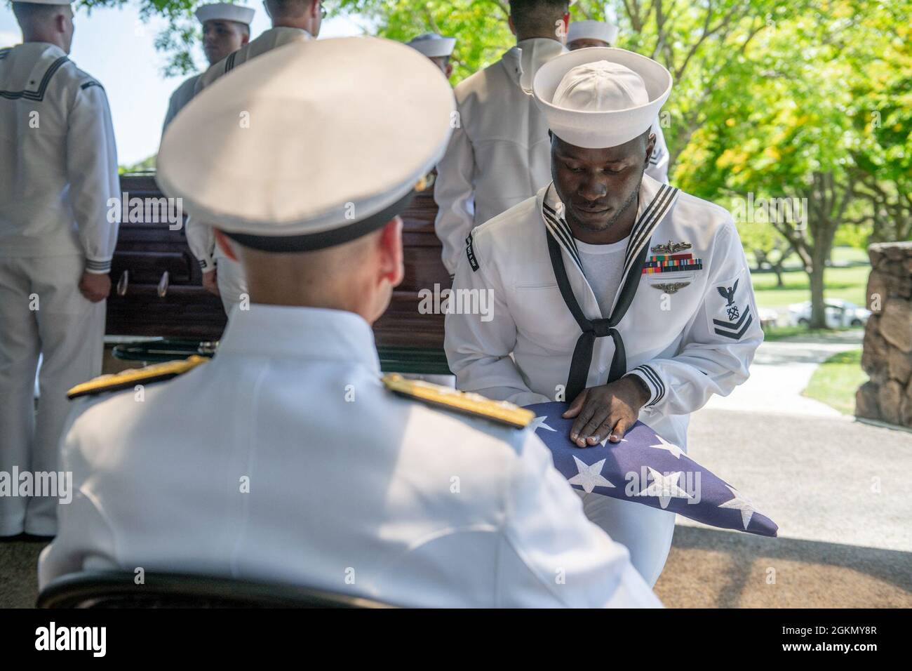 Sailors assigned to Navy Region Hawaii and the Defense POW/MIA Accounting Agency (DPAA) conduct a funeral for U.S. Navy Seaman 1st Class Camillus M. O’Grady, 19, of Greenleaf, Kansas, at the National Memorial Cemetery of the Pacific, Honolulu, Hawaii, June 1, 2021. O’Grady was assigned to the USS Oklahoma which sustained fire from Japanese aircraft and multiple torpedo hits causing the ship to capsize and resulted in the deaths of more than 400 crew members on Dec. 7, 1941, at Ford Island, Pearl Harbor. O’Grady was recently identified through DNA analysis by the DPAA forensic laboratory and la Stock Photo