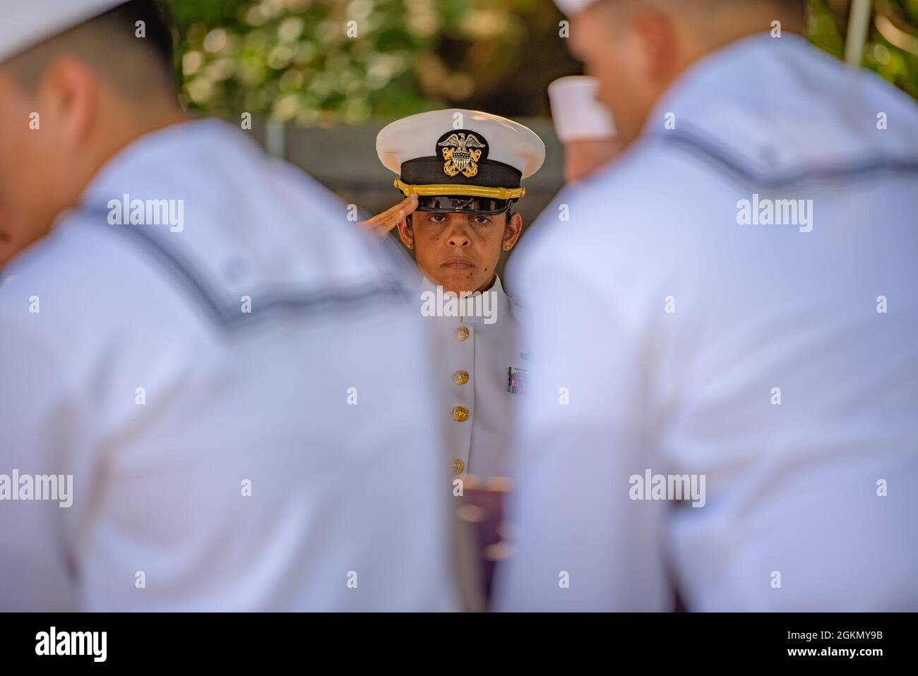Sailors assigned to Navy Region Hawaii and the Defense POW/MIA Accounting Agency (DPAA) conduct a funeral for U.S. Navy Bandmaster James B. Booe, 42, of Veedersburg, Indiana, at the National Memorial Cemetery of the Pacific, Honolulu, Hawaii, June 1, 2021. Booe was assigned to the USS Oklahoma, which sustained fire from Japanese aircraft and multiple torpedo hits causing the ship to capsize and resulted in the deaths of more than 400 crew members on Dec. 7, 1941, at Ford Island, Pearl Harbor. Booe was recently identified through DNA analysis by the DPAA forensic laboratory and laid to rest wit Stock Photo