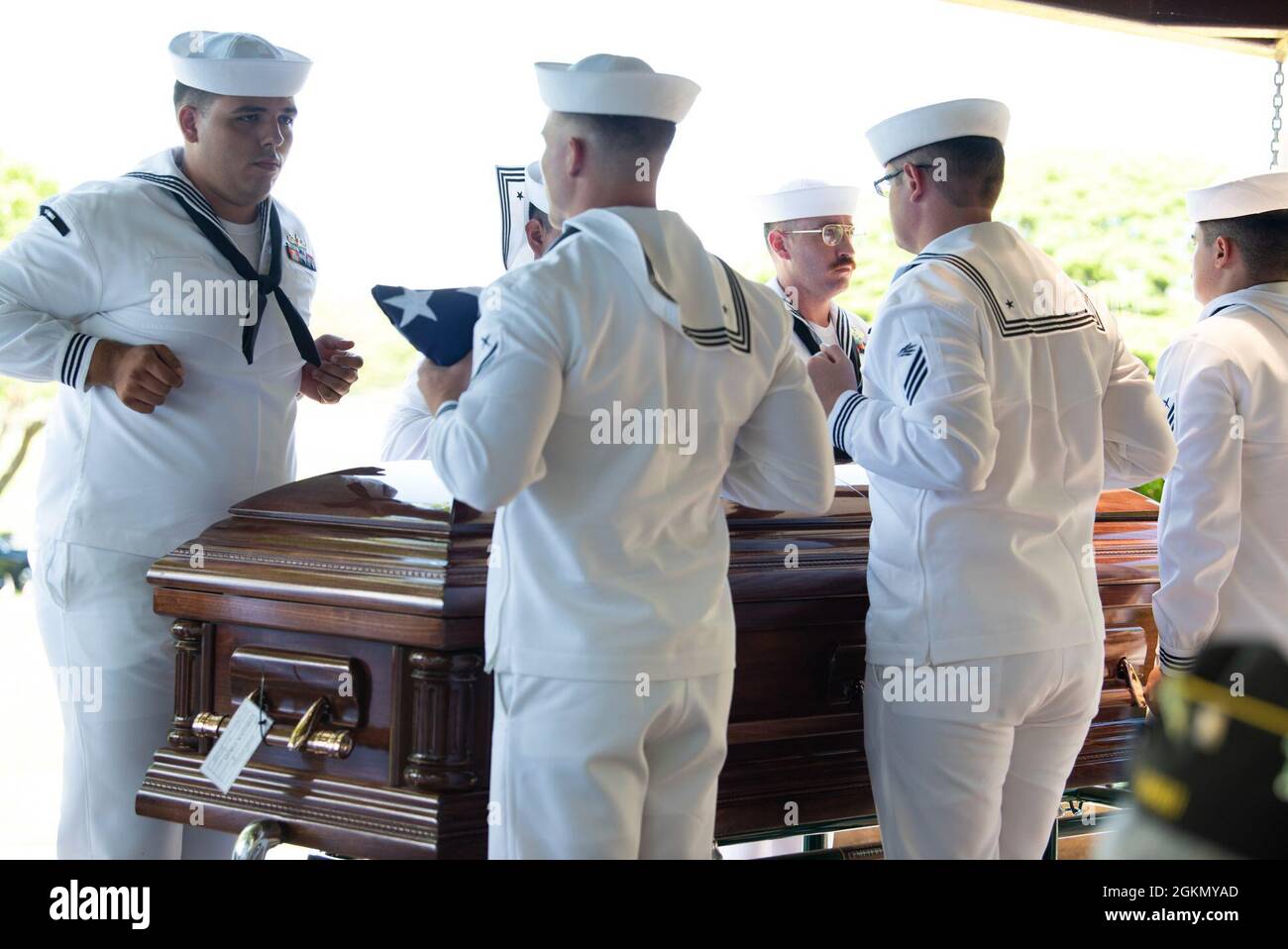 Sailors assigned to Navy Region Hawaii and the Defense POW/MIA Accounting Agency (DPAA) conduct a funeral for U.S. Navy Seaman 1st Class Camillus M. O’Grady, 19, of Greenleaf, Kansas, at the National Memorial Cemetery of the Pacific, Honolulu, Hawaii, June 1, 2021. O’Grady was assigned to the USS Oklahoma which sustained fire from Japanese aircraft and multiple torpedo hits causing the ship to capsize and resulted in the deaths of more than 400 crew members on Dec. 7, 1941, at Ford Island, Pearl Harbor. O’Grady was recently identified through DNA analysis by the DPAA forensic laboratory and la Stock Photo