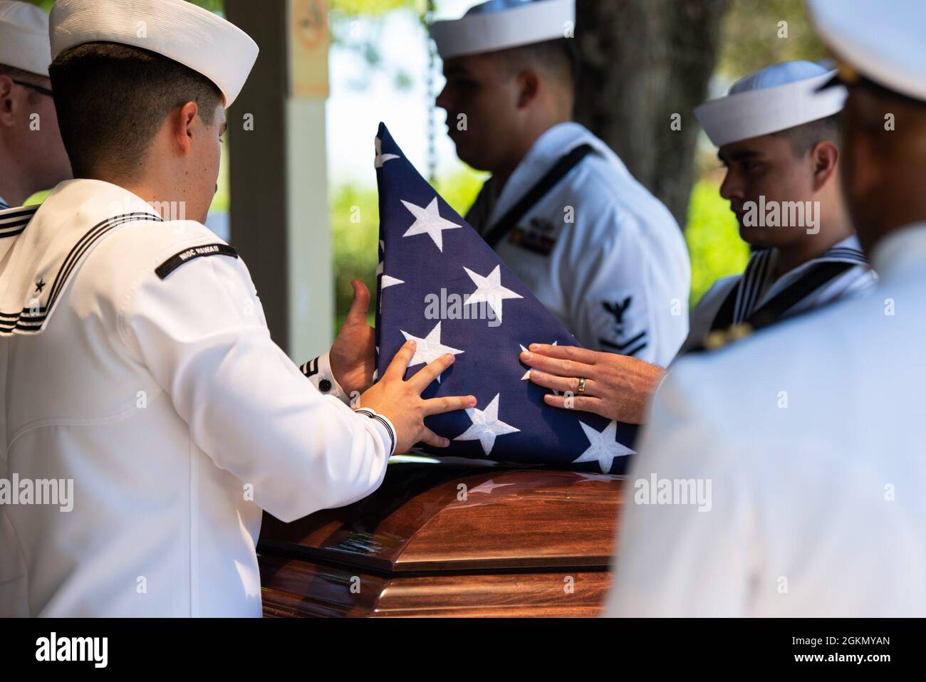 Sailors assigned to Navy Region Hawaii and the Defense POW/MIA Accounting Agency (DPAA) conduct a funeral for U.S. Navy Navy Seaman 1st Class Camillus M. O’Grady, 19, of Greenleaf, Kansas, at the National Memorial Cemetery of the Pacific, Honolulu, Hawaii, June 1, 2021. O’Grady was assigned to the USS Oklahoma, which sustained fire from Japanese aircraft and multiple torpedo hits causing the ship to capsize and resulted in the deaths of more than 400 crew members on Dec. 7, 1941, at Ford Island, Pearl Harbor. O’Grady was recently identified through DNA analysis by the DPAA forensic laboratory Stock Photo