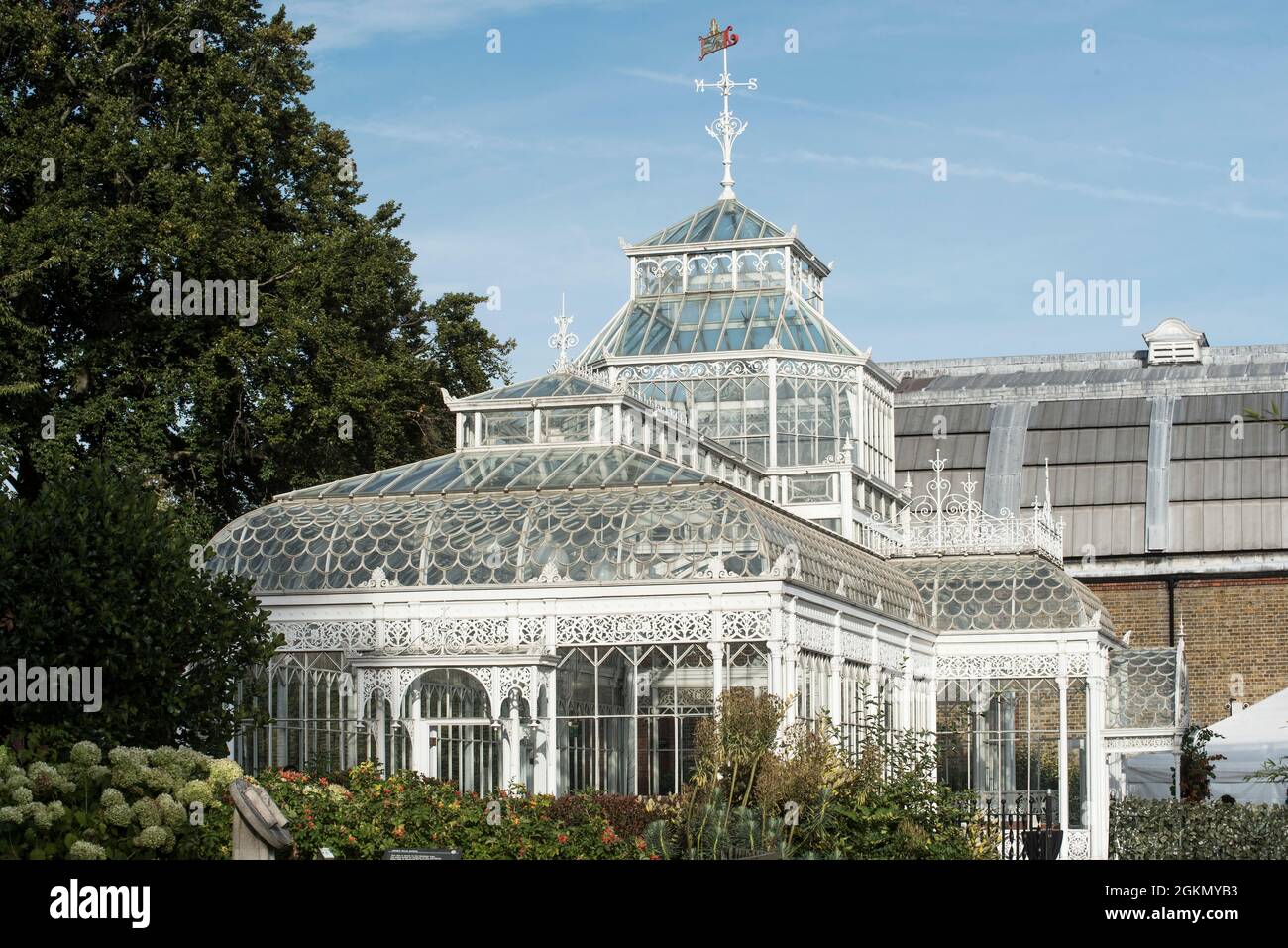Detail of an ornate Victorian cast iron conservatory / greenhouse painted white. Stock Photo