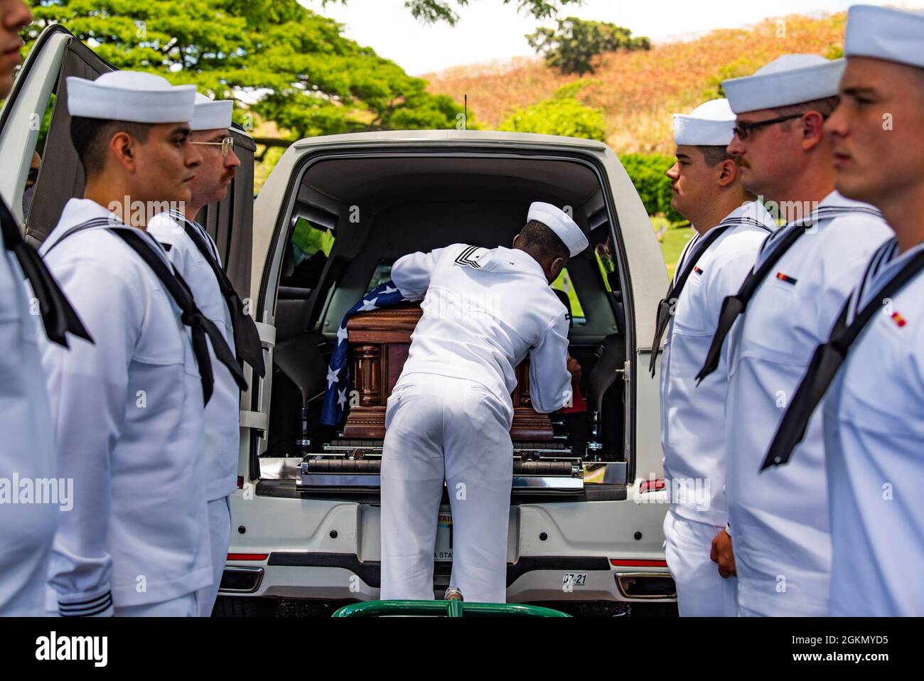 Sailors assigned to Navy Region Hawaii and the Defense POW/MIA Accounting Agency (DPAA) conduct a funeral for U.S. Navy Navy Seaman 1st Class Camillus M. O’Grady, 19, of Greenleaf, Kansas, at the National Memorial Cemetery of the Pacific, Honolulu, Hawaii, June 1, 2021. O’Grady was assigned to the USS Oklahoma, which sustained fire from Japanese aircraft and multiple torpedo hits causing the ship to capsize and resulted in the deaths of more than 400 crew members on Dec. 7, 1941, at Ford Island, Pearl Harbor. O’Grady was recently identified through DNA analysis by the DPAA forensic laboratory Stock Photo