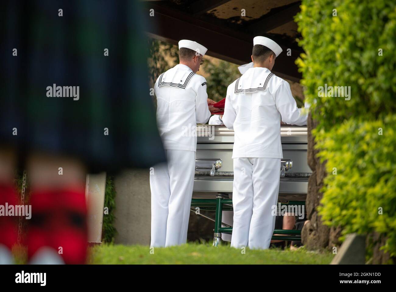 Sailors assigned to Navy Region Hawaii and the Defense POW/MIA Accounting Agency (DPAA) conduct a funeral for U.S. Navy Gunner’s Mate 3rd Class Shelby Treadway, 25, of Manchester, Kentucky, at the National Memorial Cemetery of the Pacific, Honolulu, Hawaii, June 2, 2021. Treadway was assigned to the USS Oklahoma, which sustained fire from Japanese aircraft and multiple torpedo hits causing the ship to capsize and resulted in the deaths of more than 400 crew members on Dec. 7, 1941, at Ford Island, Pearl Harbor. Treadway was recently identified through DNA analysis by the DPAA forensic laborato Stock Photo