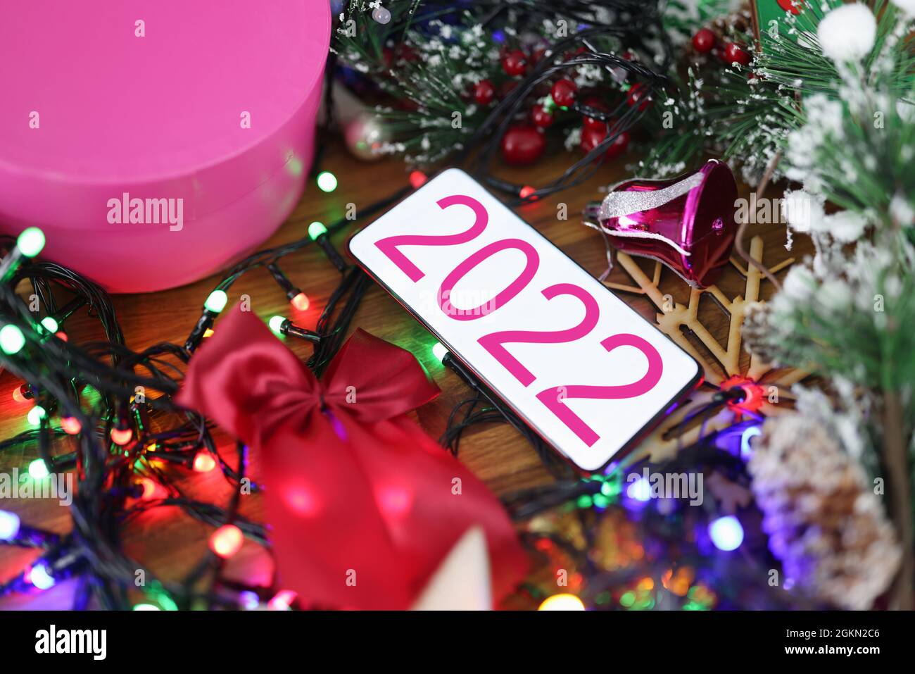 Christmas 2022 Phone Mobile Phone With 2022 On Screen Lying Among Christmas Tinsel Closeup  Background Stock Photo - Alamy