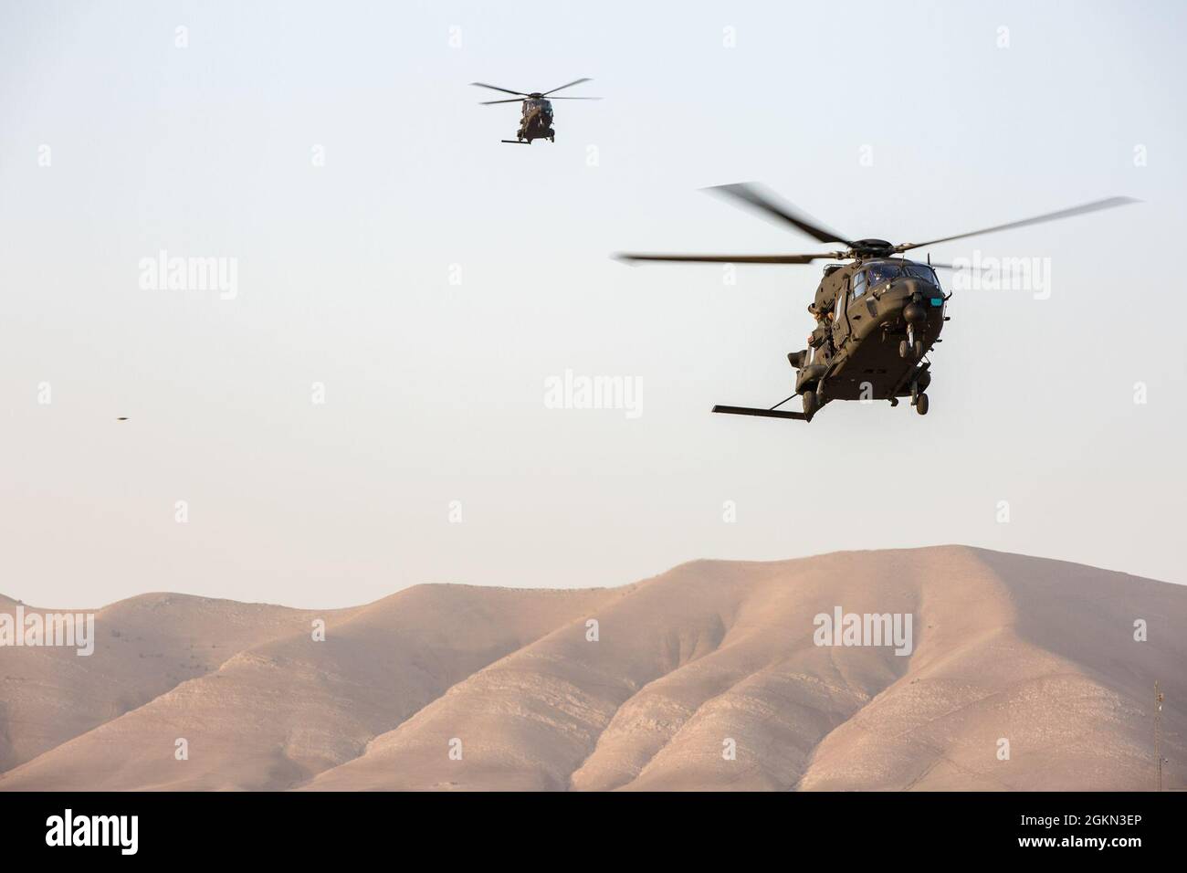 Italian helicopter pilots assigned to the Combined Joint Task Force (CJTF) arrive to pick up Coalition Forces in Soleymanya, Iraq., June 3, 2021. Helicopter pilots are tasked out all around the Combined/Joint Operations Area. Stock Photo
