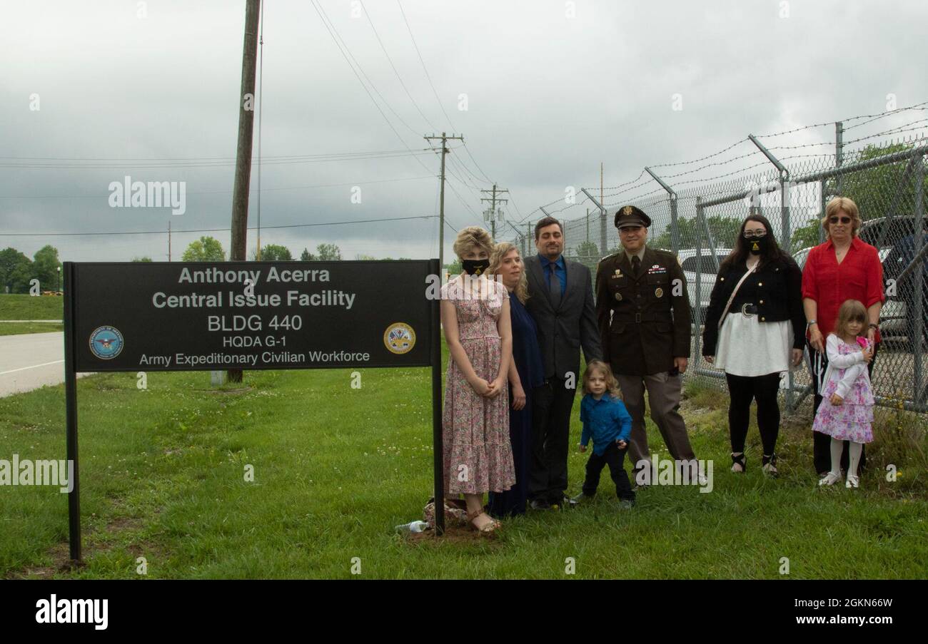 The family of Mr. Anthony A. Acerra, a former Army Civilian with the Defense Contract Management Agency killed in action, pose outside of the building dedicated to Acerra with Lt. Gen. David G. Bassett, Director of the DCMA, at Camp Atterbury, Indiana, June 3, 2021. Acerra was assigned to DCMA Central Afghanistan, Camp Phoenix, Kabul, Afghanistan on his fifth deployment when his convoy was attacked on October 29, 2011. Stock Photo