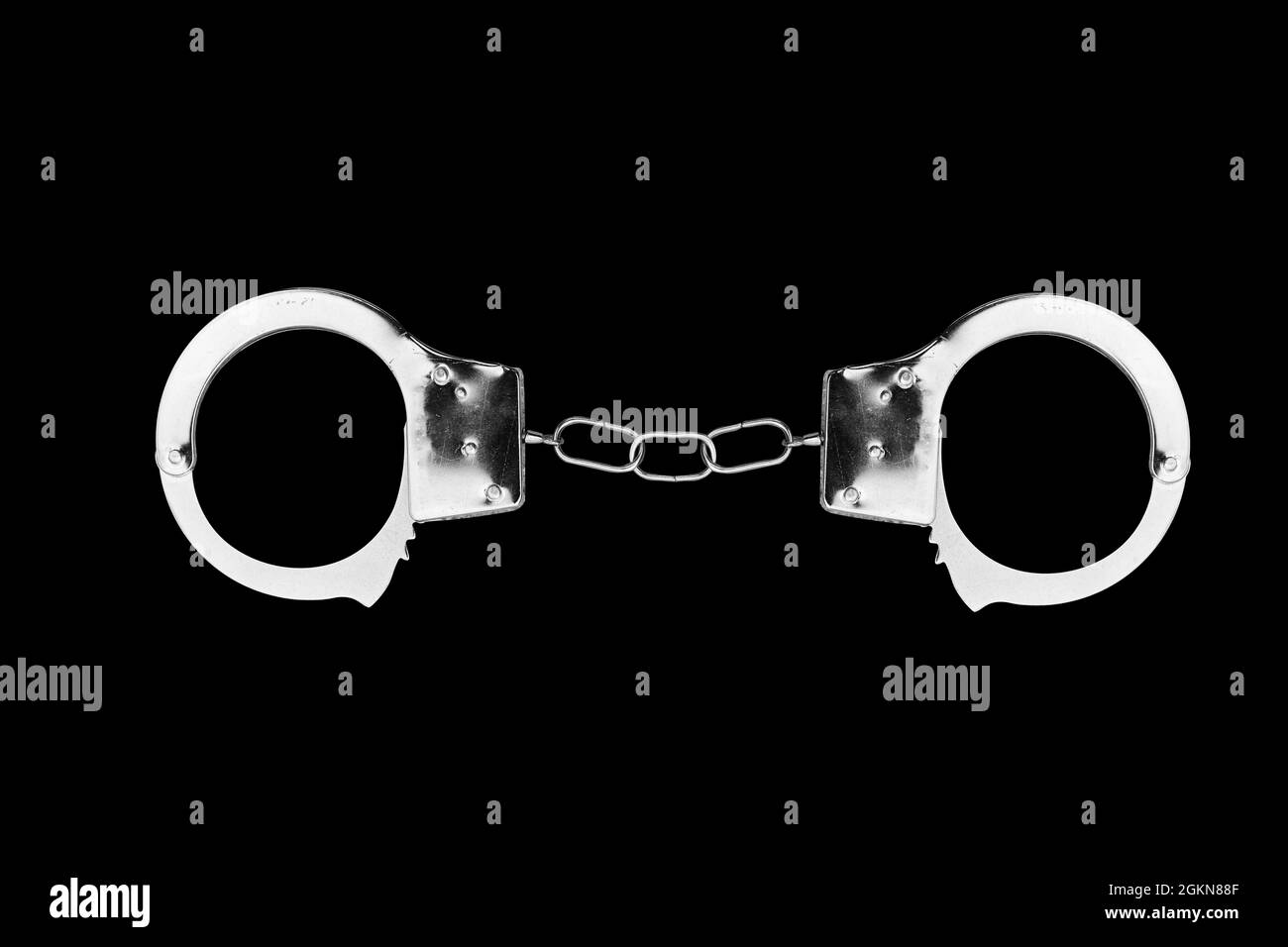 handcuffs isolated on a black background. High quality photo Stock