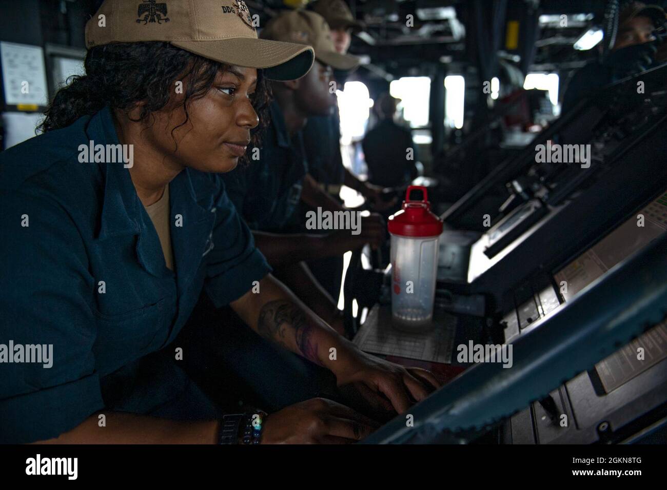 210603-N-HG846-1005 SEA OF JAPAN (June 3, 2021) – Retail Specialist Seaman Alescia Pugh, from Schenectady, N.Y., mans the lee helm in the pilot house aboard Arleigh Burke-class guided-missile destroyer USS Rafael Peralta (DDG 115). Rafael Peralta is assigned to Commander, Task Force 71/Destroyer Squadron (DESRON) 15, the Navy's largest forward-deployed DESRON and U.S. 7th Fleet's principal surface force. Stock Photo