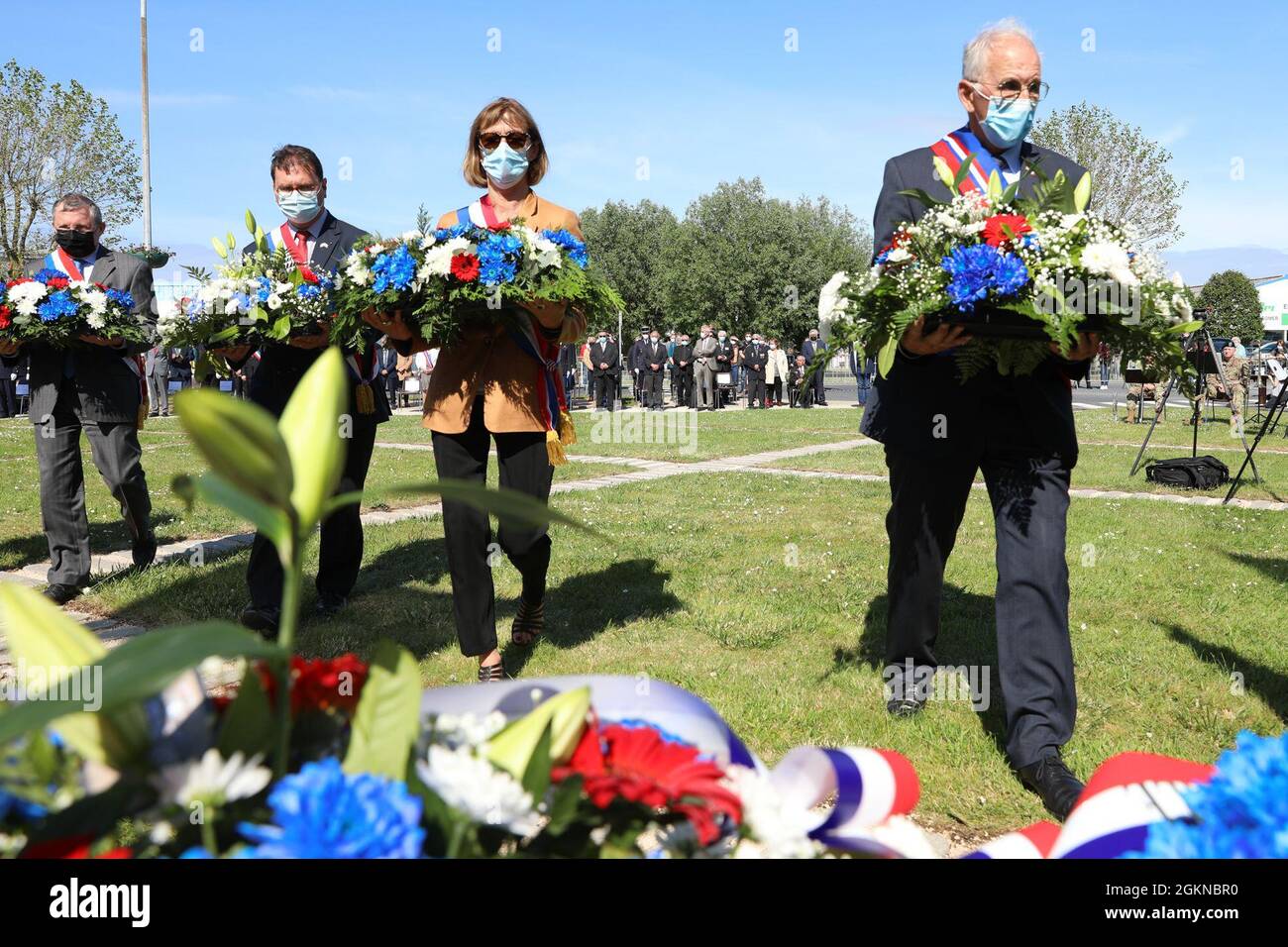 Distinguished guest place wreaths in front of the Hancock Monument at