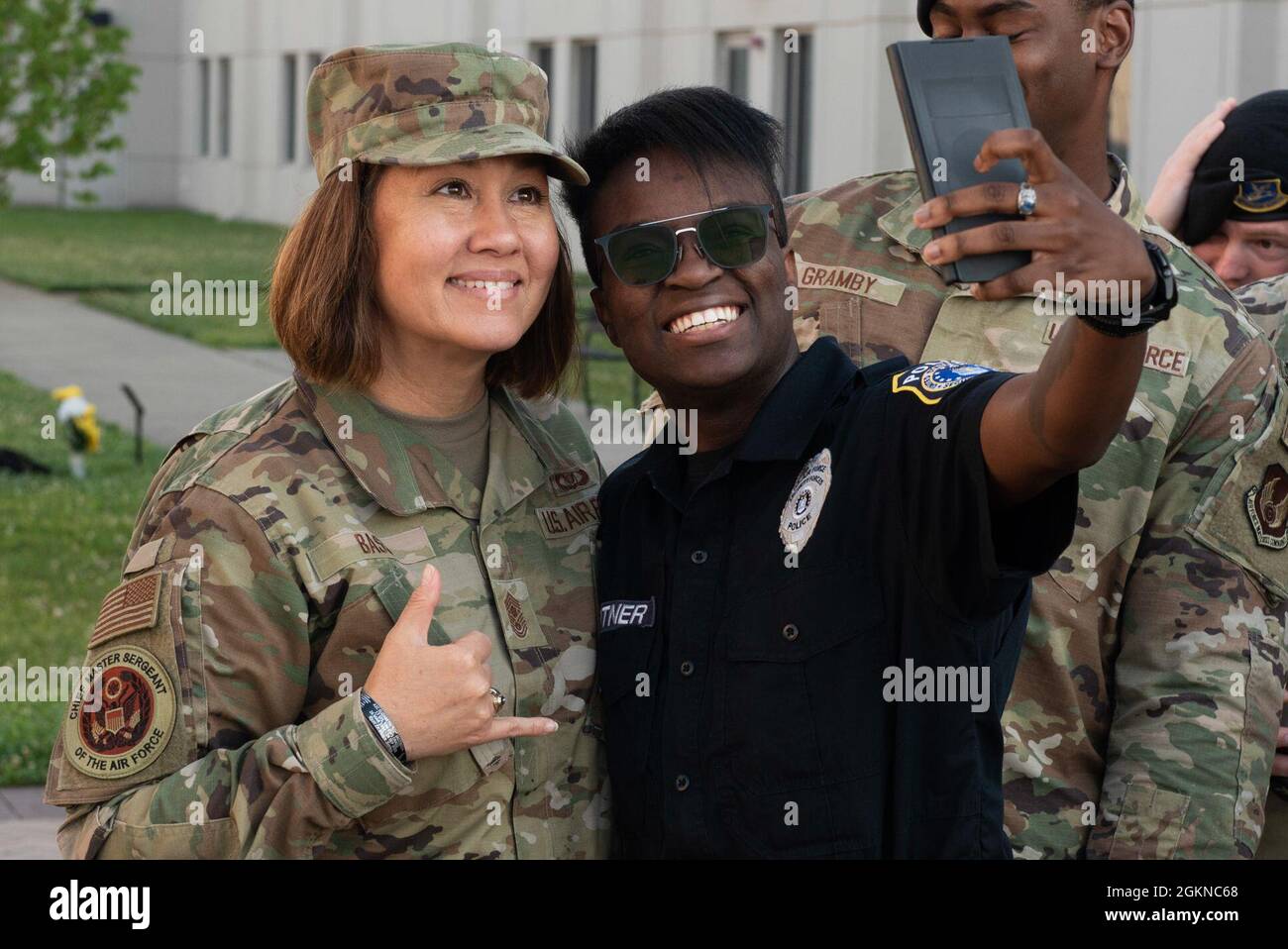 Chief Master Sergeant of the Air Force JoAnne S. Bass poses for a photo with a member of the 88th Security Forces Squadron during a visit to the unit June 4 2021