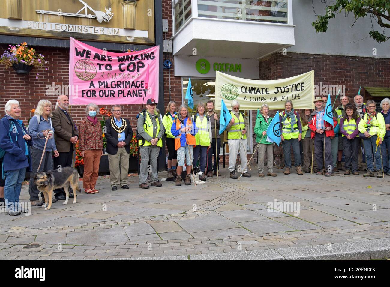 Leominster, Herefordshire, UK. 15th September 2021. Marchers assemble in Leominster town centre at the start of their 'Camino to Cop' pilgrimage to the COP26  Climate Change Conference in Glasgow. The group will join hundreds of other Walkers from all over the UK on the 'Pilgrimage For The Planet' which arrives in  Glasgow on October 30th.  G.P. Essex/Alamy Live News Stock Photo