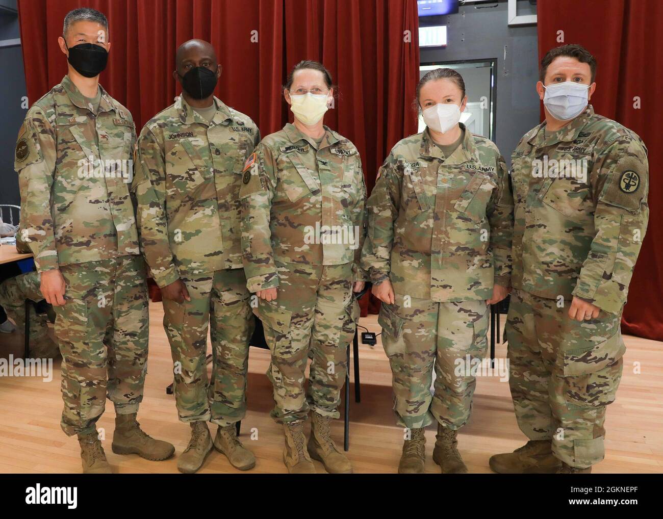 (From left) U.S. Air Force Col. Peter Kim, Chief Medical Officer, Landstuhl Regional Medical Center, U.S. Army Sgt. 1st Class Eldon Johnson, noncommissioned officer in charge, 452nd Combat Support Hospital (CSH), 330th Medical Brigade, 807th Medical Command, U.S. Army Reserve, U.S. Army Col. Ines Berger, commander, 452nd CSH, U.S. Maj. Marielos Vega, chief, Quality and Safety, LRMC, and Sgt. 1st Class Jeffrey Hicks, noncommissioned officer in charge, Department of Public Health, LRMC, stand at the LRMC COVID-19 vaccination site, where the 452nd CSH worked with LRMC to administer thousands of v Stock Photo