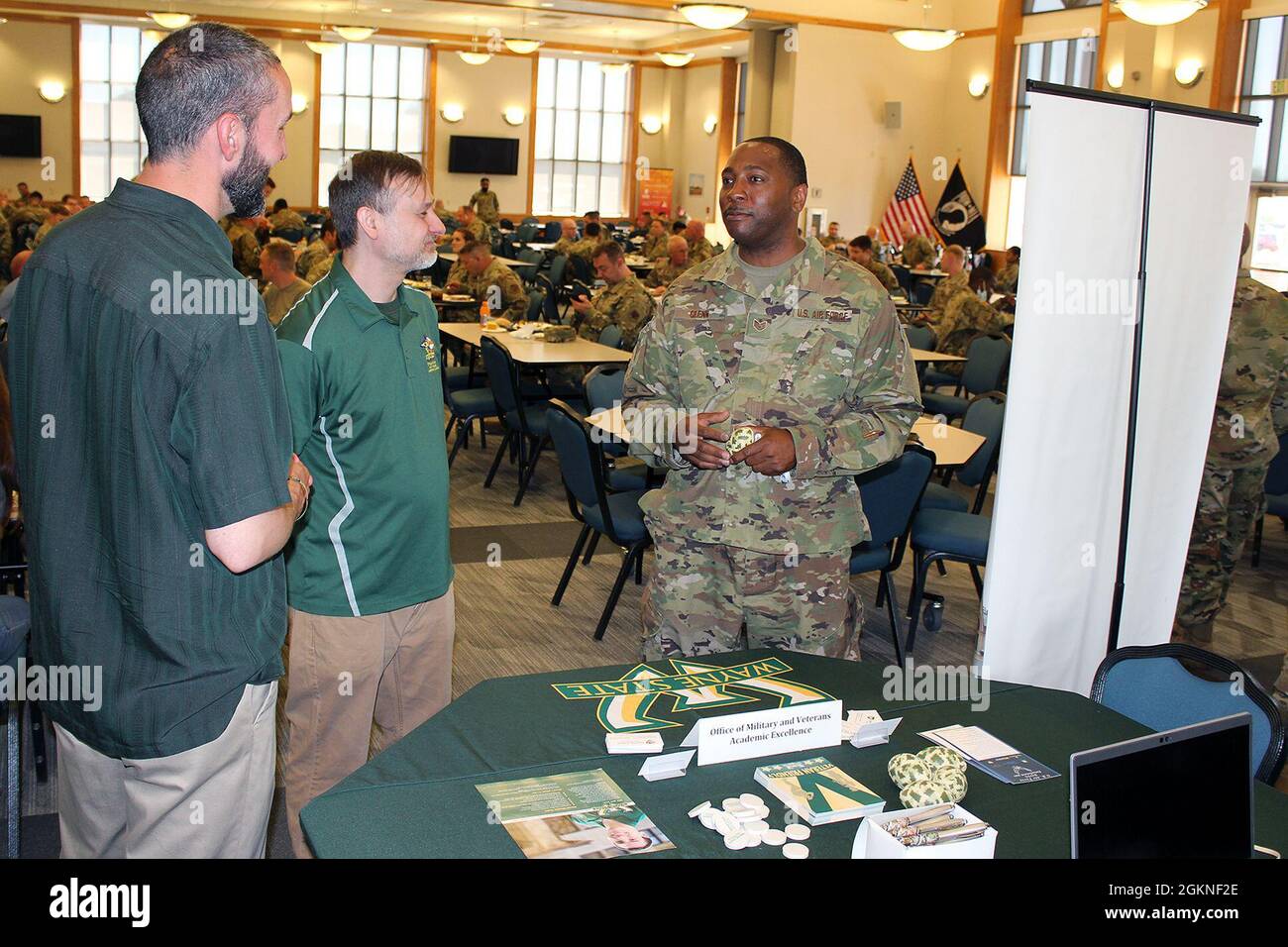 Staff Sgt. Greg Glenn, 127th Force Support Squadron, talks with representatives of Wayne State University, about support the university offers for veterans to attend college, while at Selfridge Air National Guard Base, Mich., June 5, 2021. Information from several universities and other agencies were avialable to military personnel during the lunch break as part of the Stay Guard program, which encourages Airmen to continue to serve in the Michigan Air National Guard. Stock Photo
