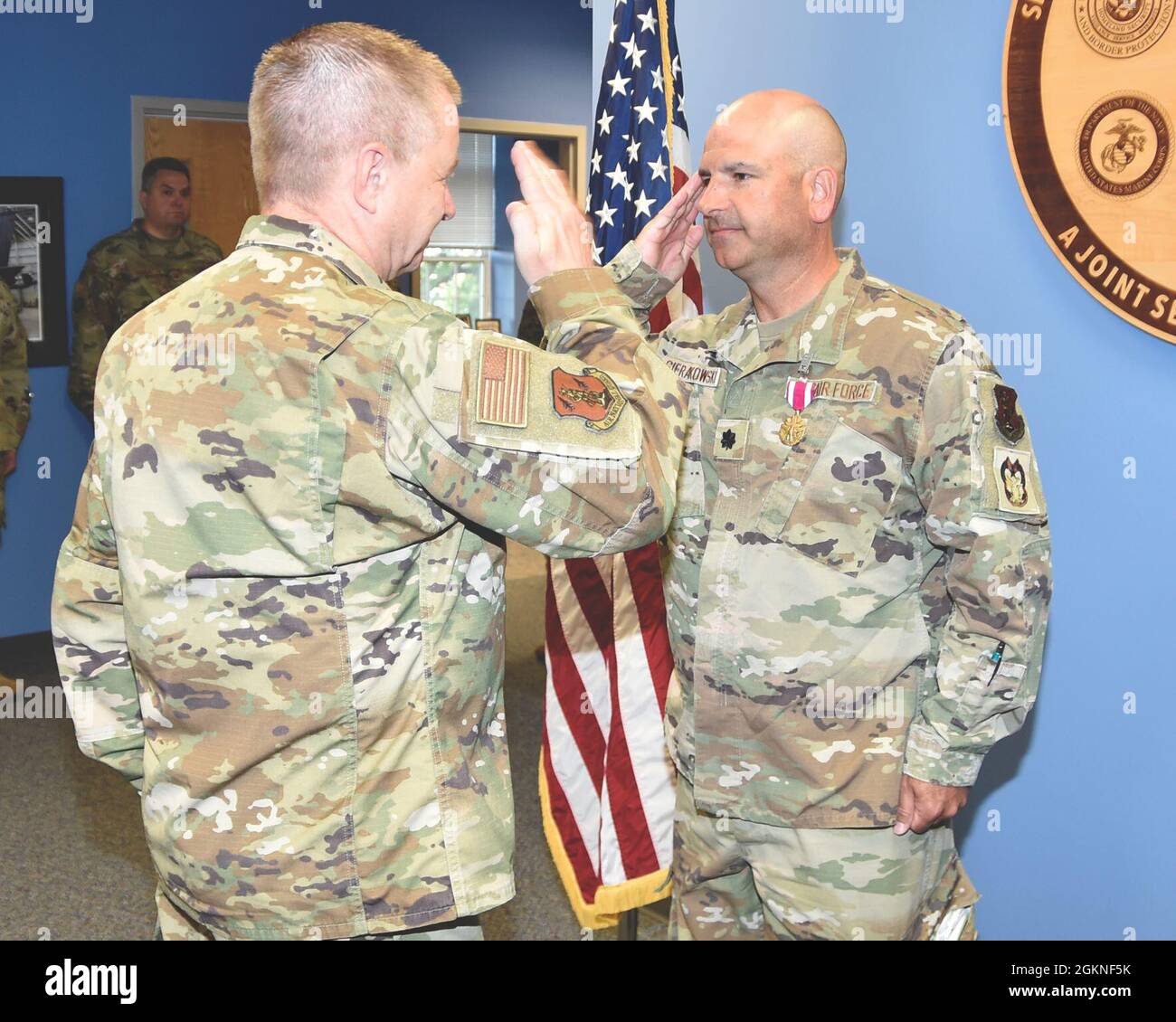 SELFRIDGE AIR NATIONAL GUARD BASE, Mich.— Lt. Col. Thomas Sierakowski, inspector general of the 127th Wing here,  salutes Brig. Gen. Rolf E. Mammen, 127th Wing commander, after receiving the Meritorious Service Medal here, on June 5, 2021. Stock Photo