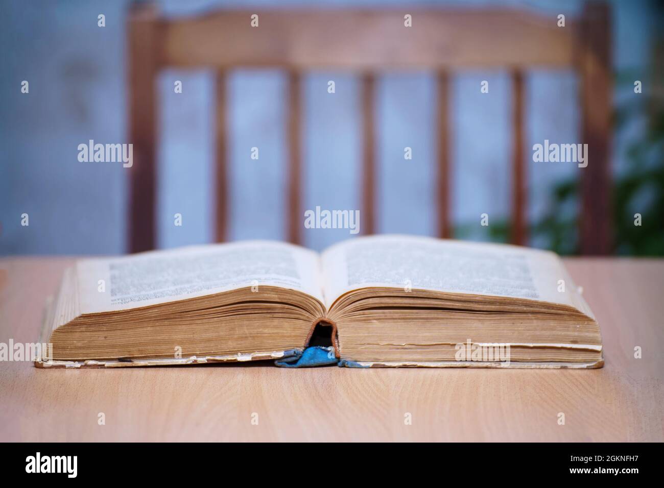 An open book on a wooden table. Selective focus Stock Photo