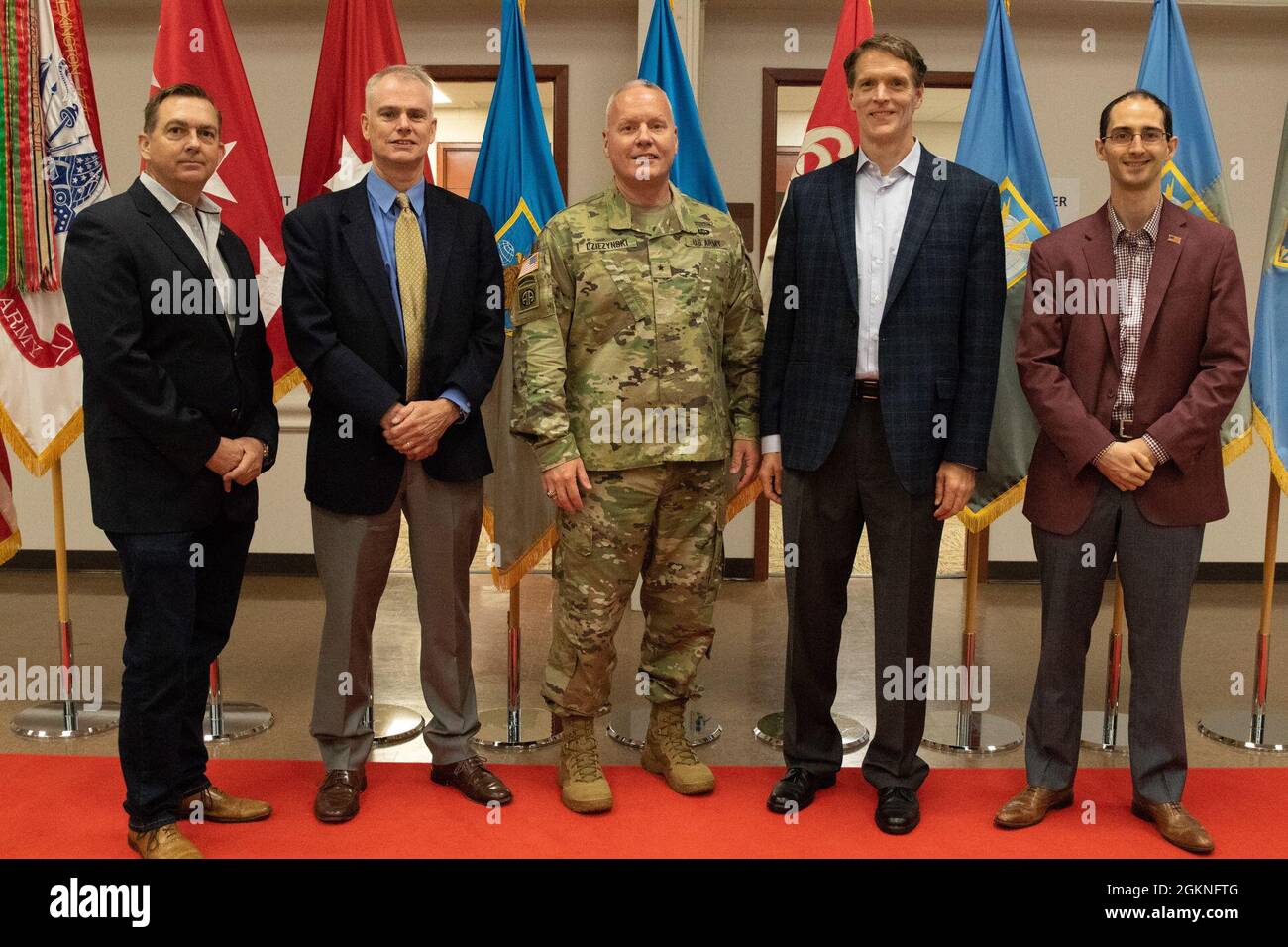 Military Intelligence Readiness Command (MIRC) Commanding General Brig. Gen. Joseph Dziezynski poses with fellow colleagues from his civilian occupation with Northrop Grumman after the MIRC assumption of command ceremony, Fort Belvoir, Virginia, June 5, 2021. Stock Photo