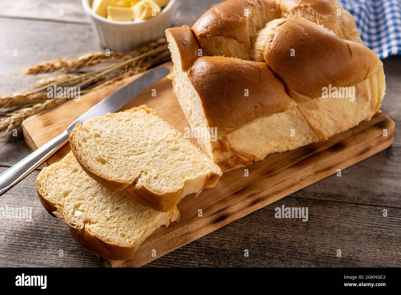 Braided egg bread on wooden table Stock Photo