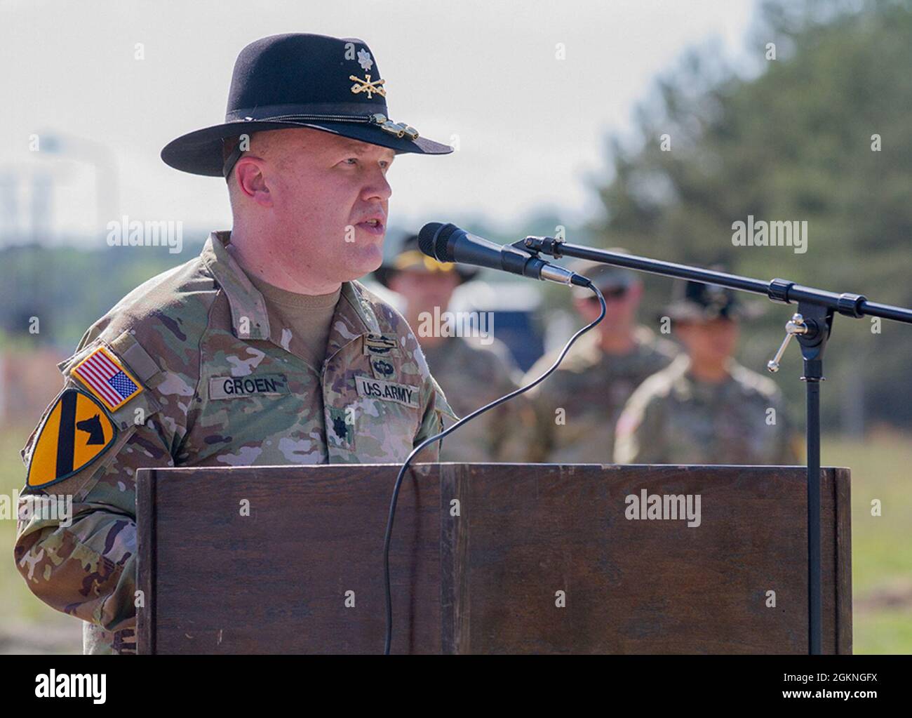 Army Lt. Col. Richard Groen, outgoing commander for 1st Squadron, 7th Cavalry Regiment “Garryowen,” gives his farewell address to his Soldiers and distinguished guests during a change of command ceremony at Forward Operating Site Drawsko Pomorskie Training Area, Poland, on June 5, 2021. Groen will soon take command of 3rd Squadron, 3rd Security Force Assistance Brigade. Stock Photo