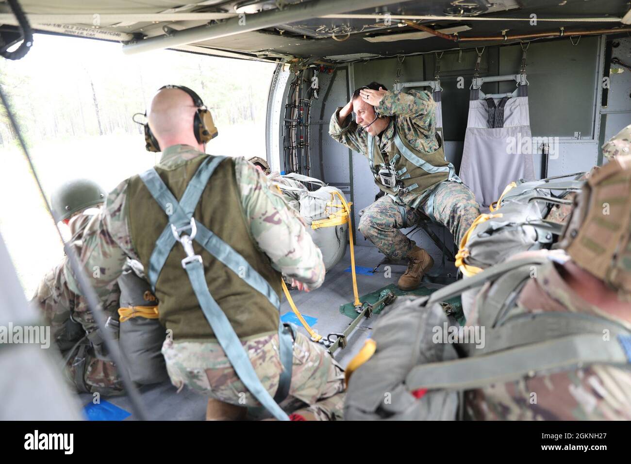 U.S. Army Reserve Lt. Col. Stephen M. Cowne, Jr., G33 and jumpmaster for the U.S. Army Civil Affairs and Psychological Operations Command (Airborne), watches as Capt. Ignacio Rios, a Chilean jumpmaster assigned to the 1st Special Warfare Training Group(A), U.S. Army John F. Kennedy Special Warfare Center and School Stock Photo