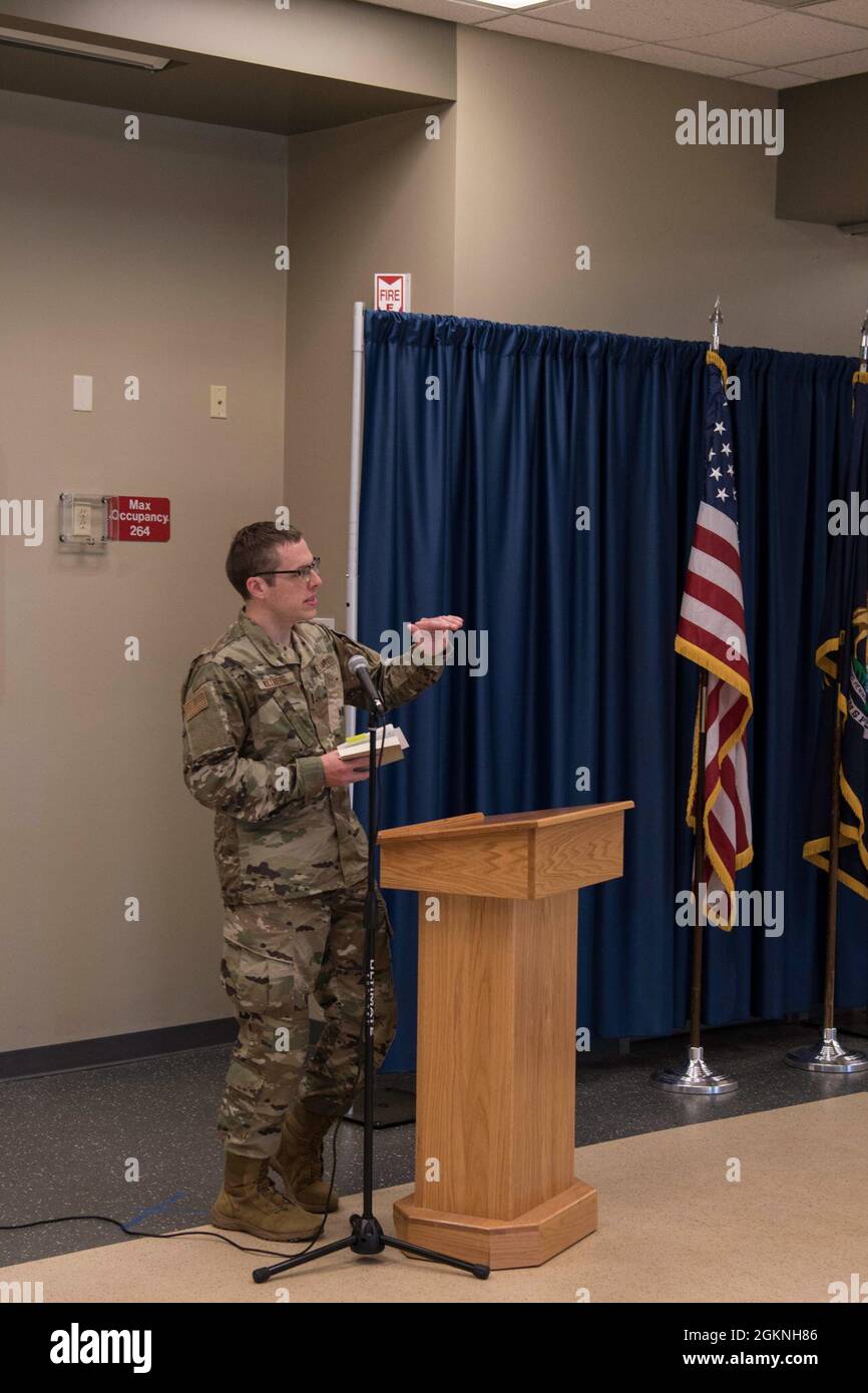 Chaplain 1st Lt. Trenton Wollberg reads scripture during a prayer