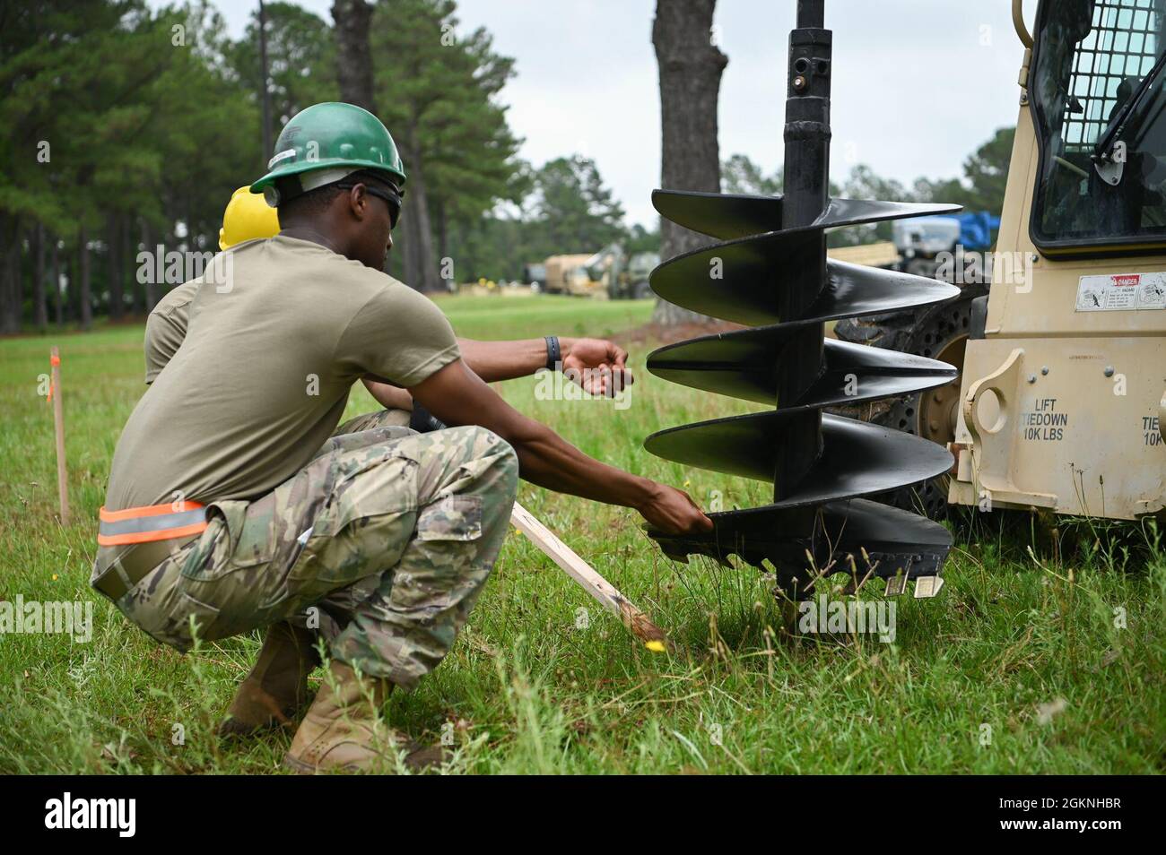 U.S. Army National Guard Soldiers with the 1223rd Vertical Engineering Company, South Carolina National Guard, build an air assault obstacle course June 6, 2021, at McCrady Training Center, Eastover, South Carolina. The course is intended for future training operations that will take place at the training center. Stock Photo