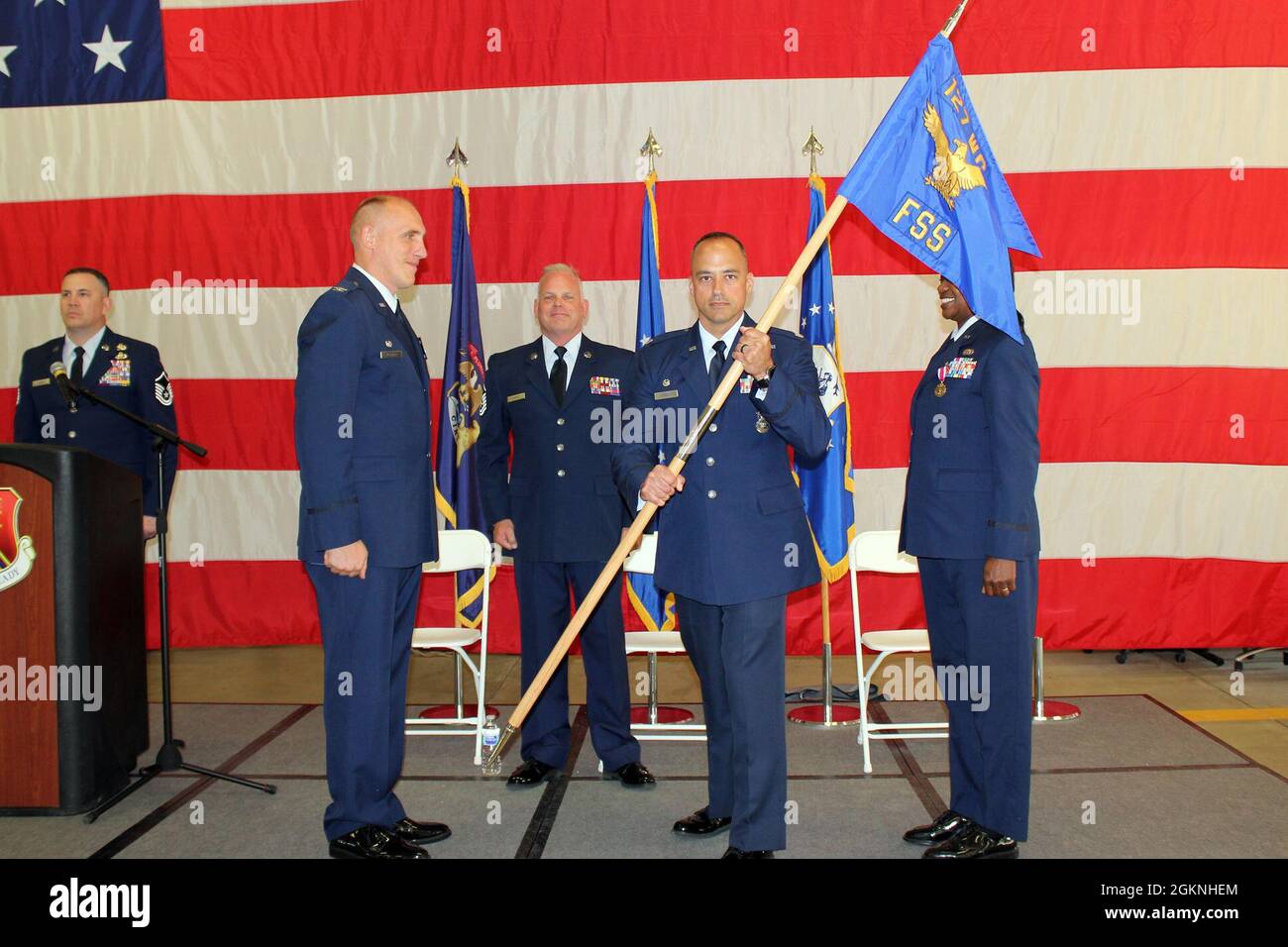 Lt. Col. Sam Trapasso holds the guidon of the 127th Force Support Squadron after taking command of the squadron in a formal ceremony at Selfridge Air National Guard Base, Mich., June 6, 2021. Trapasso accepted the guidon from 127th Mission Support Group commander Lt. Col. Daniel Kramer. Major Camille Horne is the outgoing commander and is moving to a positon at the Air National Guard Readiness Center. Stock Photo
