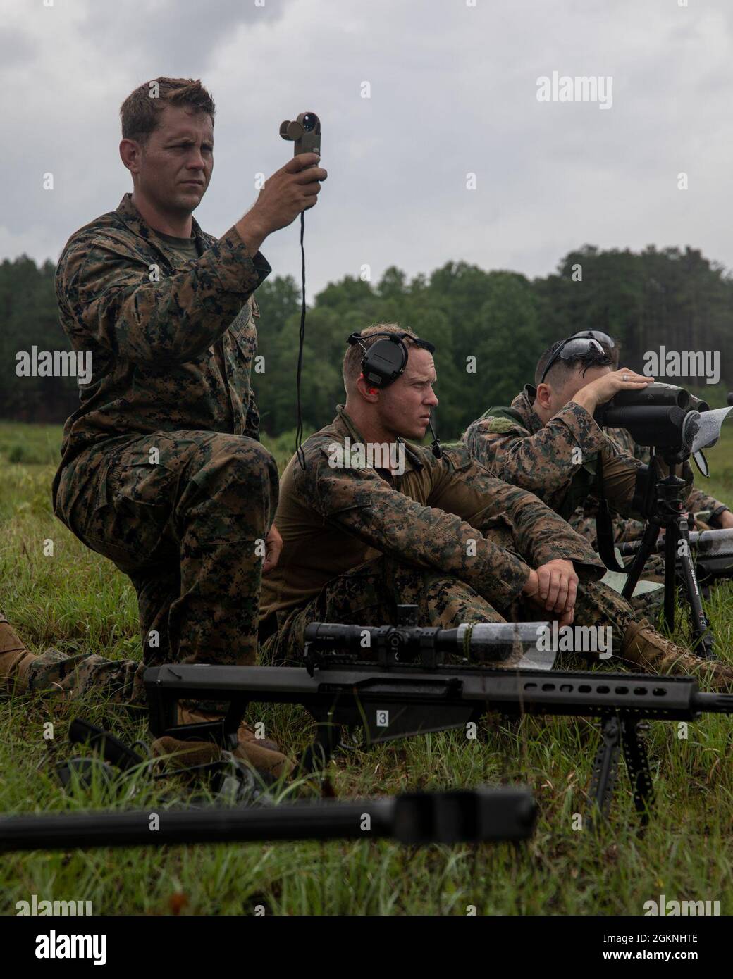 Marines with 3rd Force Reconnaissance Company, 4th Marine Division, prepare their equipment during sniper training at Camp Shelby, Mississippi, on June 6, 2021. The Marines trained with the M107 semi-automatic long-range sniper rifle, an anti-materiel rifle that fires .50 caliber ammunition out to a maximum effective range of 2000 meters. Stock Photo
