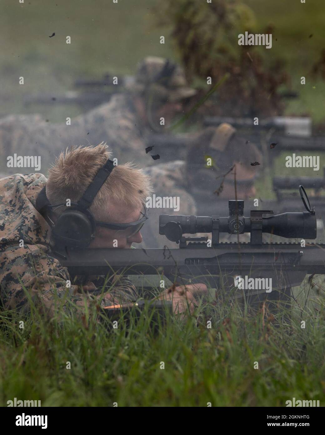 Marines with 3rd Force Reconnaissance Company, 4th Marine Division, fire down range during sniper training at Camp Shelby, Mississippi, on June 6, 2021. The Marines trained with the M107 semi-automatic long-range sniper rifle, an anti-materiel rifle that fires .50 caliber ammunition out to a maximum effective range of 2000 meters. Stock Photo