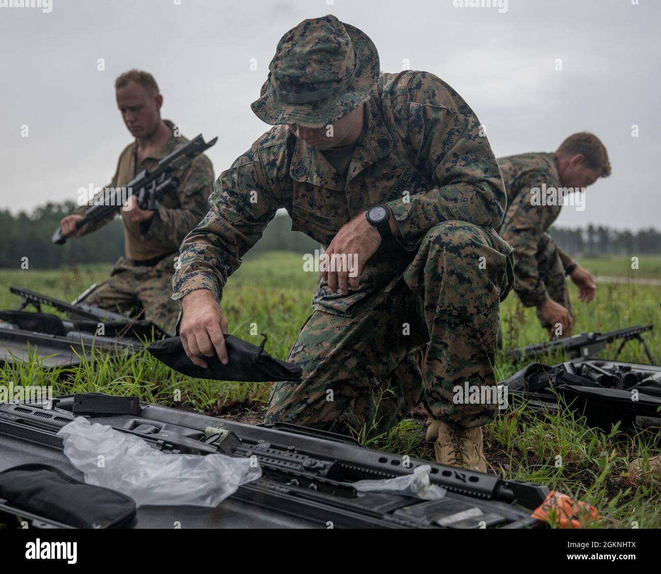 Marines with 3rd Force Reconnaissance Company, 4th Marine Division, assemble their rifles during sniper training at Camp Shelby, Mississippi, on June 6, 2021. The Marines trained with the M107 semi-automatic long-range sniper rifle, an anti-materiel rifle that fires .50 caliber ammunition out to a maximum effective range of 2000 meters. Stock Photo