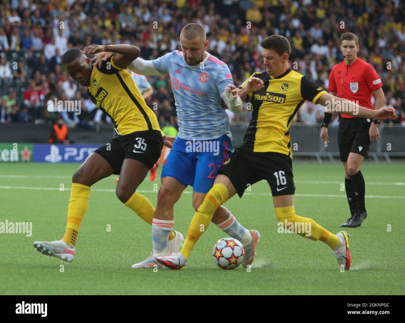 Luke Shaw of Manchester United and Christopher Martins Pereira , Christian Fassnacht of Young Boys Berne during the UEFA Champions League, Group Stage, Group F football match between Young Boys Berne and Manchester United on September 14, 2021 at Stade de Suisse in Berne, Switzerland - Photo Laurent Lairys / DPPI Stock Photo