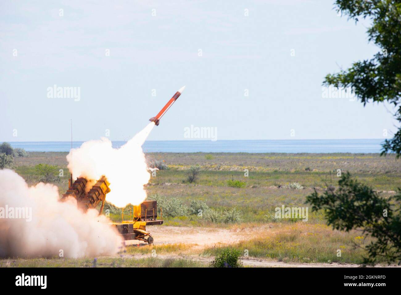CAPU MIDIA TRAINING AREA, Romania — A MIM-104 Patriot missile system fires a missile during a field exercise, June 9, 2021. Missile systems were being live fired as part of a live-fire exercise for Saber Guardian, an exercise with DEFENDER-Europe 21. Stock Photo