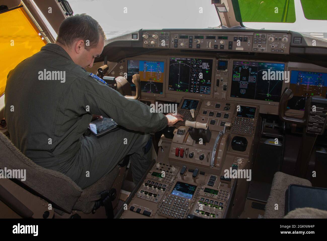 Capt. Travis Frazier, 344th Air Refueling Squadron pilot, reviews aircraft information in the cockpit of a KC-46A Pegasus aircraft on the Naval Support Activity Souda Bay, Greece, airfield June 8, 2021. NSA Souda Bay is an operational ashore base that enables U.S., allied, and partner nation forces to be where they are needed when they are needed to ensure security and stability in Europe, Africa, and Southwest Asia. Stock Photo