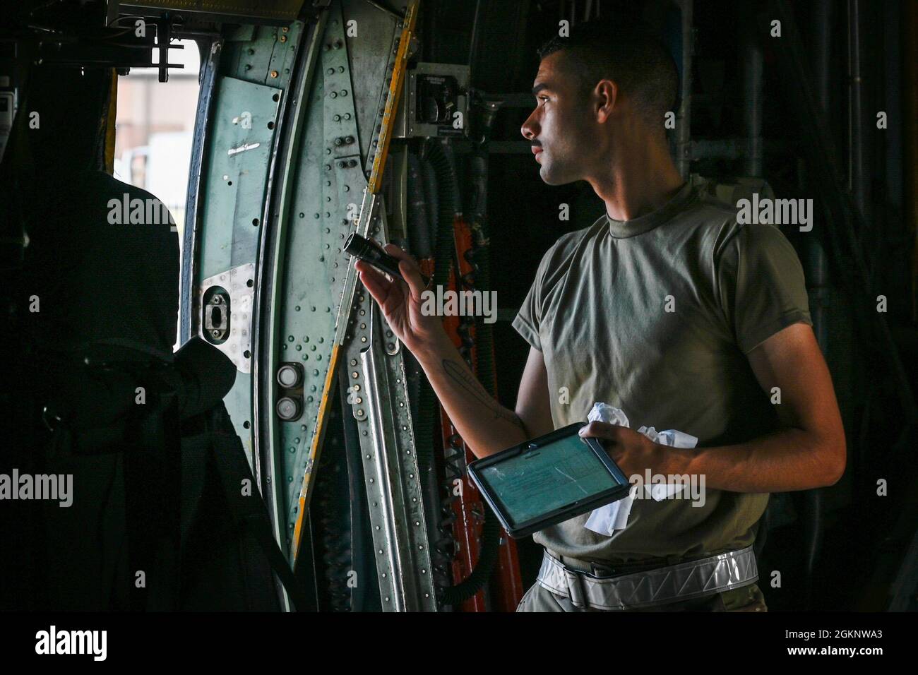 Airman 1st Class Alexy Lobo, 103rd Aircraft Maintenance Squadron crew chief, conducts a preflight inspection on a C-130H Hercules aircraft at Bradley Air National Guard Base in East Granby, Connecticut, June 8, 2021. Crew chiefs ensure that the aircraft in their care are maintained to the most exacting standards and ready to fly at a moment’s notice so that aircrews can safely and effectively complete their mission. Stock Photo