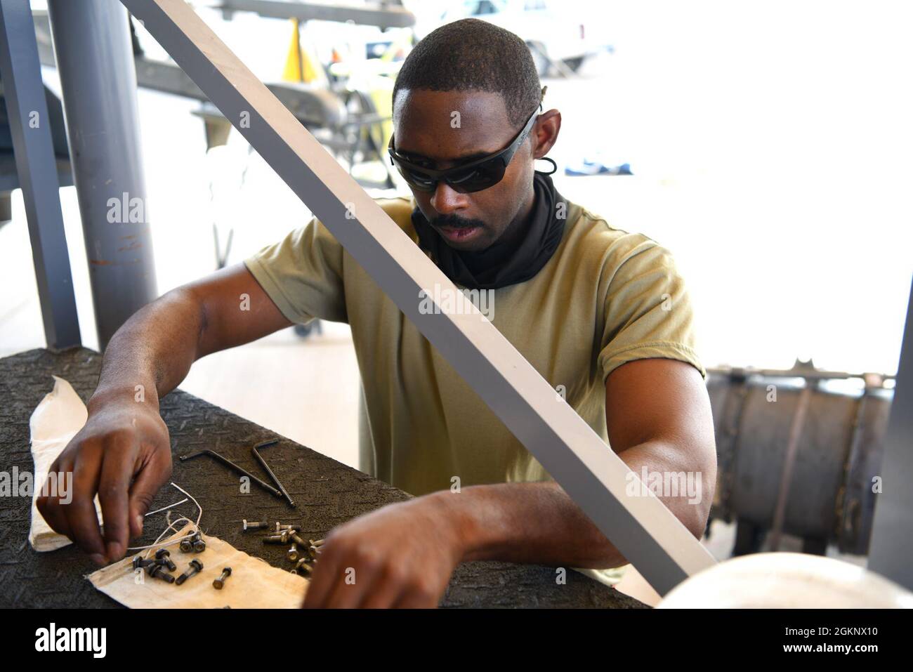 U.S. Air Force Staff Sgt. Kajuan Archer, 378th Expeditionary Maintenance Squadron armament backshop personnel, ensures accountability of parts from an M61A1 Vulcan cannon removed from an F-16 Fighting Falcon fighter jet at Prince Sultan Air Base, Kingdom of Saudi Arabia, June 8, 2021. The 'Swamp Fox' Airmen from the South Carolina Air National Guard are deployed to PSAB to project combat power and help bolster defensive capabilities against potential threats in the region. Stock Photo