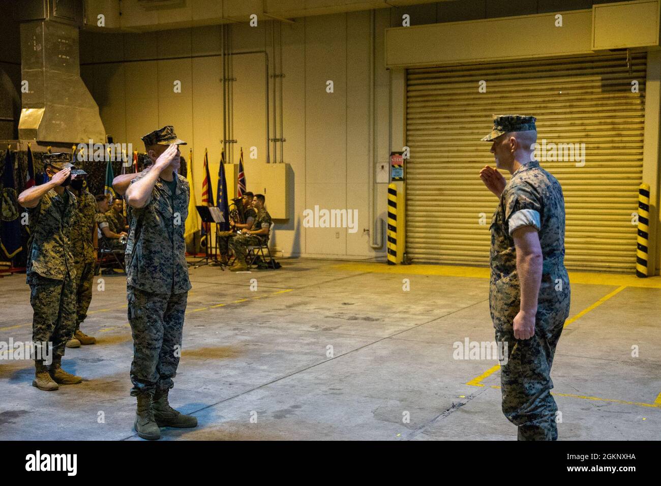 U.S. Marine Corps Maj. Matthew Curry, the executive officer of Marine Tactical Air Command Squadron (MTACS) 18, salutes the staff during their deactivation ceremony at Marine Corps Air Station Futenma, Okinawa, Japan, June 9, 2021. MTACS-18 is being deactivated in order to adapt to Force Design 2030, a 10 year plan to make the Marine Corps a more modern and lethal fighting force. Stock Photo