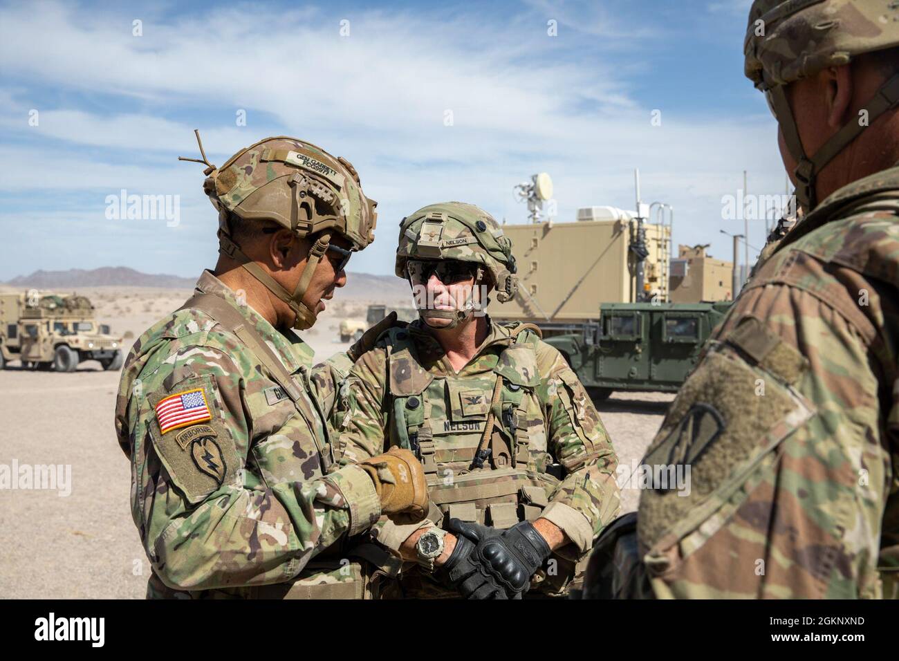 Gen. Michael Garrett, commanding general, United States Army Forces Command, converses with Col. Jason P. Nelson, the 155th Armored Brigade Combat Team commander, Mississippi Army National Guard, at the National Training Center, Fort Irwin, California, June 9, 2021. The purpose of Garrett’s visit is to observe and engage with leaders and Soldiers with the 155th ABCT during their rotational training. Stock Photo