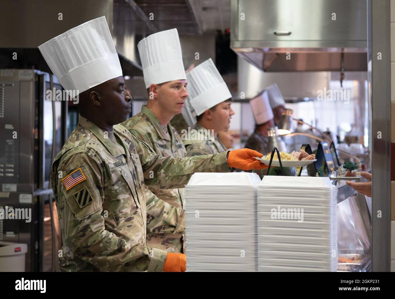 The 3rd Battalion, 67th Armored Regiment, 2nd Armored Brigade Combat Team, 3rd Infantry Division, command team serve their Soldiers and Family members during the U.S Army's 246th birthday celebration at the 2nd ABCT dining facility on Fort Stewart, Georgia, June 10, 2021. The Army celebrates 246 years of service since its founding on June 14, 1775, when the Continental Congress authorized enlistment for the creation of the American Continental Army. Stock Photo