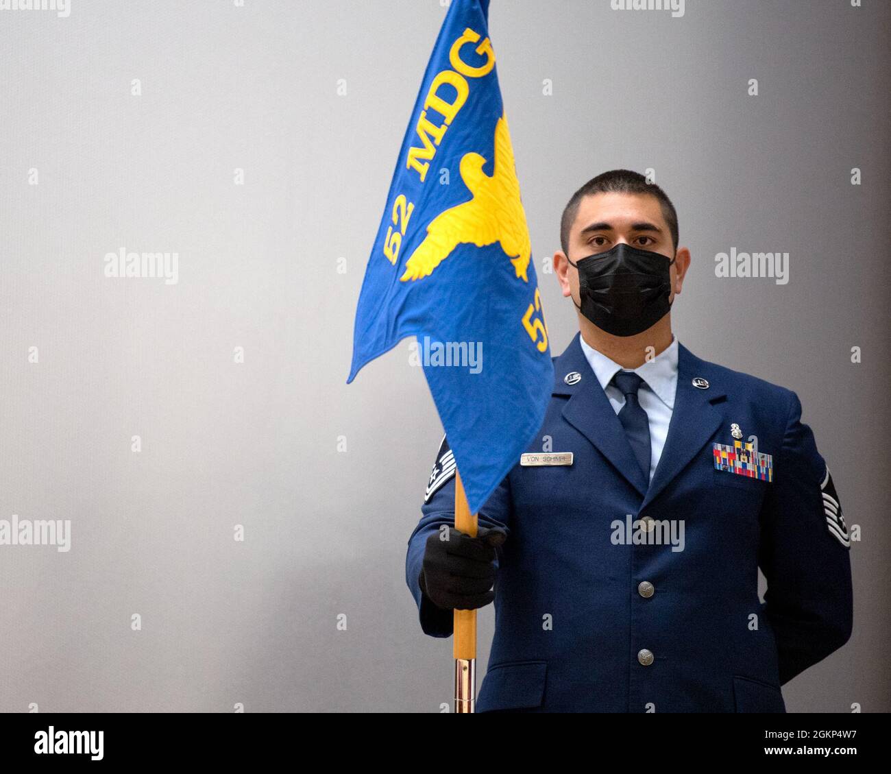 U.S. Air Force Master Sgt. Daniel Von Schimpf, former 52nd Dental Squadron clinical dentistry flight chief, holds the 52nd DS guidon during the squadron deactivation ceremony June 10, 2021, on Spangdahlem Air Base, Germany. As part of an Air Force Medical Service realignment, the dental squadron deactivated in order to be restructured under the 52nd Operational Medical Readiness Squadron. Stock Photo