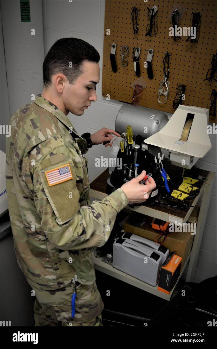 Sgt. David Sullivan, an Optical Laboratory Specialist at the General Leonard Wood Army Community Hospital, begins creating lenses where the lab fabricates between 76,000 to 80,000 eyeglasses per year for trainees and Tricare beneficiaries around the Fort Leonard Wood area. Stock Photo