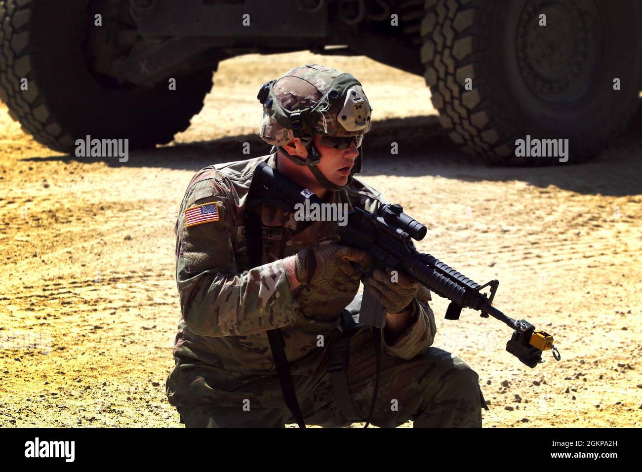 U.S. Army Reserve Soldiers from the 702nd Engineer Company stand guard as they take part in the IED lane that tests the Soldiers skills on how to react to contact during convoy operations at Fort McCoy, Wis., as part of Warrior Exercise 86-21-02, June 11, 2021. WAREX is an annual training exercise that integrates both combat support and combat service support assets to train United States Army Reserve Soldiers. Stock Photo