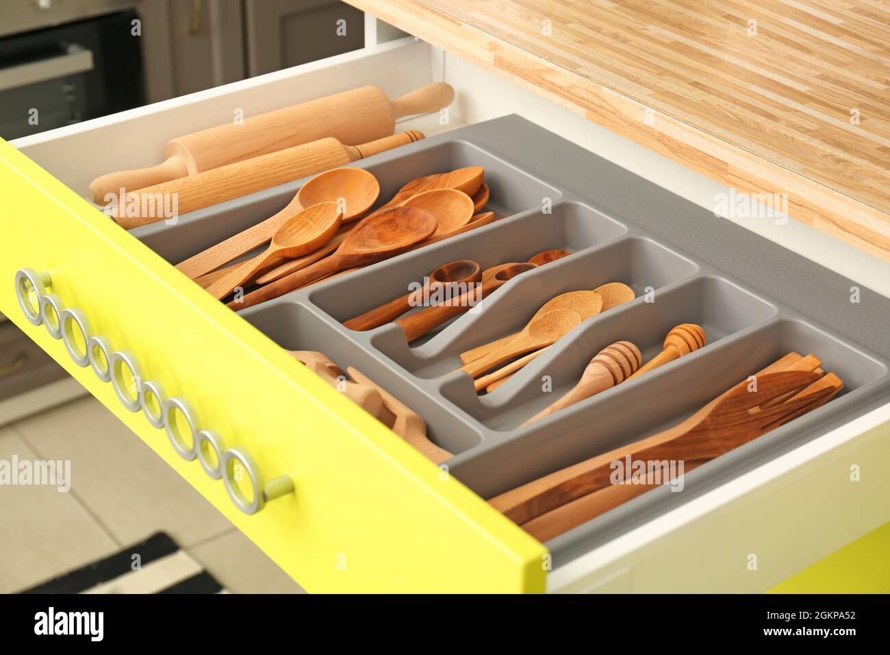 Wooden kitchen utensils in drawer indoors Stock Photo Alamy