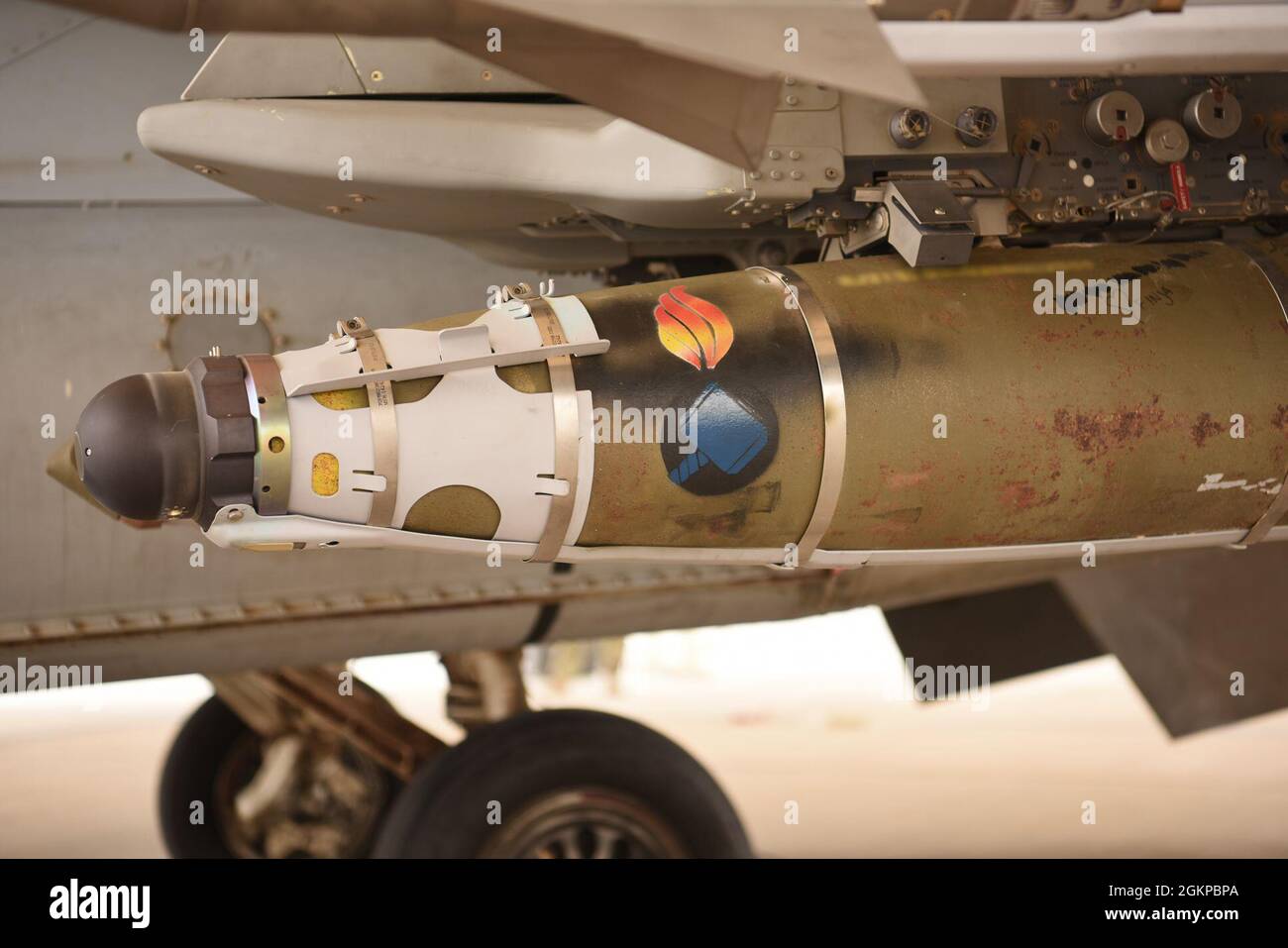 A stylized bomb graphic painted onto a GBU-54 bomb by members of the 378th Expeditionary Maintenance Squadron ammunition section, at Prince Sultan Air Base, Kingdom of Saudi Arabia, June 11, 2021. The 'Swamp Fox' Airmen from the South Carolina Air National Guard are deployed to PSAB to project combat power and help bolster defensive capabilities against potential threats in the region. Stock Photo