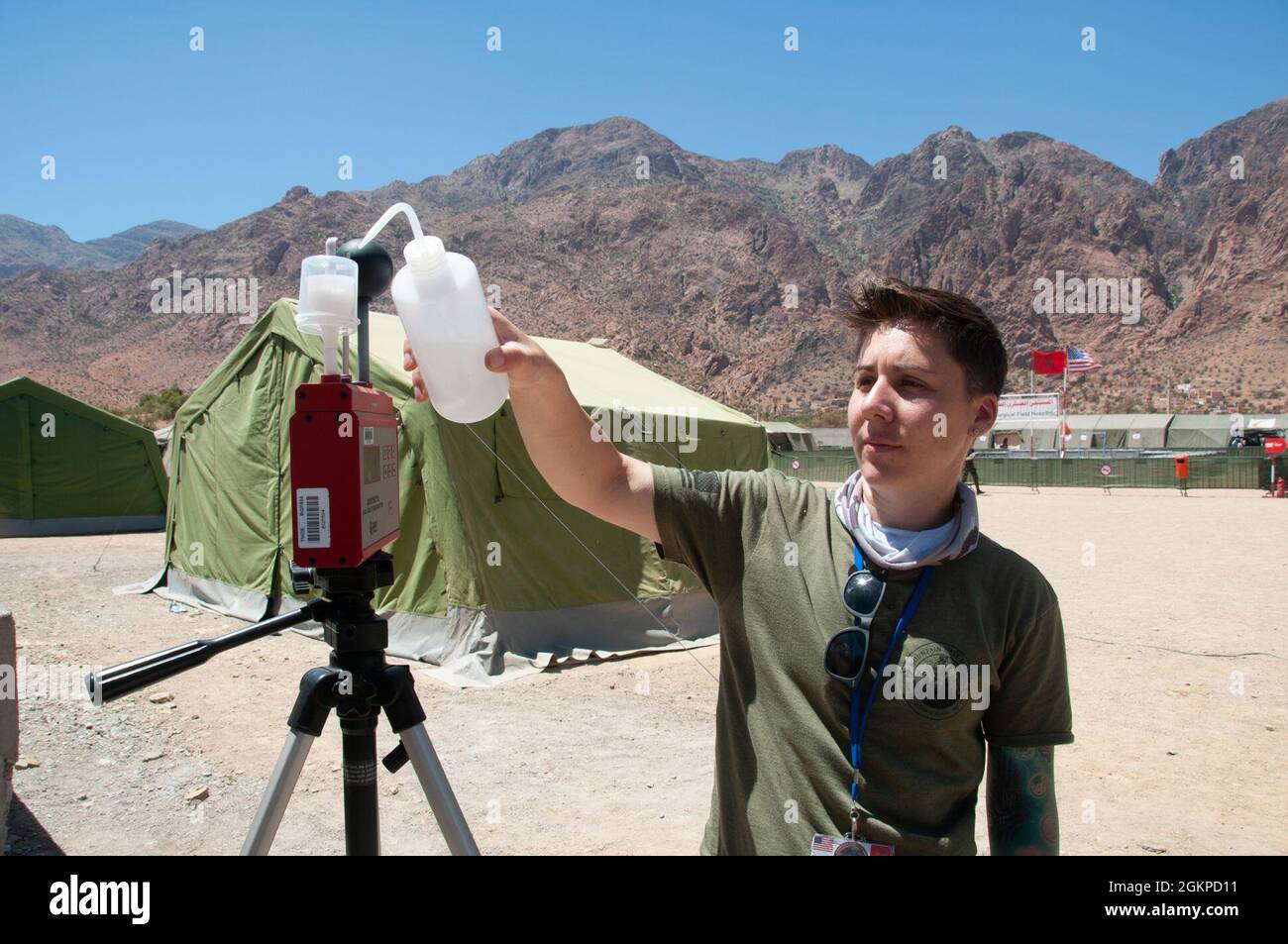 U.S. Air Force Staff Sgt. Jami Pepe, a bioenvironmental technician with the 151st Medical Group adds distilled water to the humidity reservoir of a Wet Bulb Globe Temperature measurement device in Tafraoute, Morocco on June 12, 2021 during African Lion 2021. African Lion 2021 is U.S. Africa Command’s largest, premier, joint, annual exercise hosted by Morocco, Tunisia, and Senegal, 7-18 June. More than 7,000 participants from nine nations and NATO train together with a focus on enhancing readiness for us and partner nation forces. AL21 is multi-domain, null-component, and multinational exercise Stock Photo