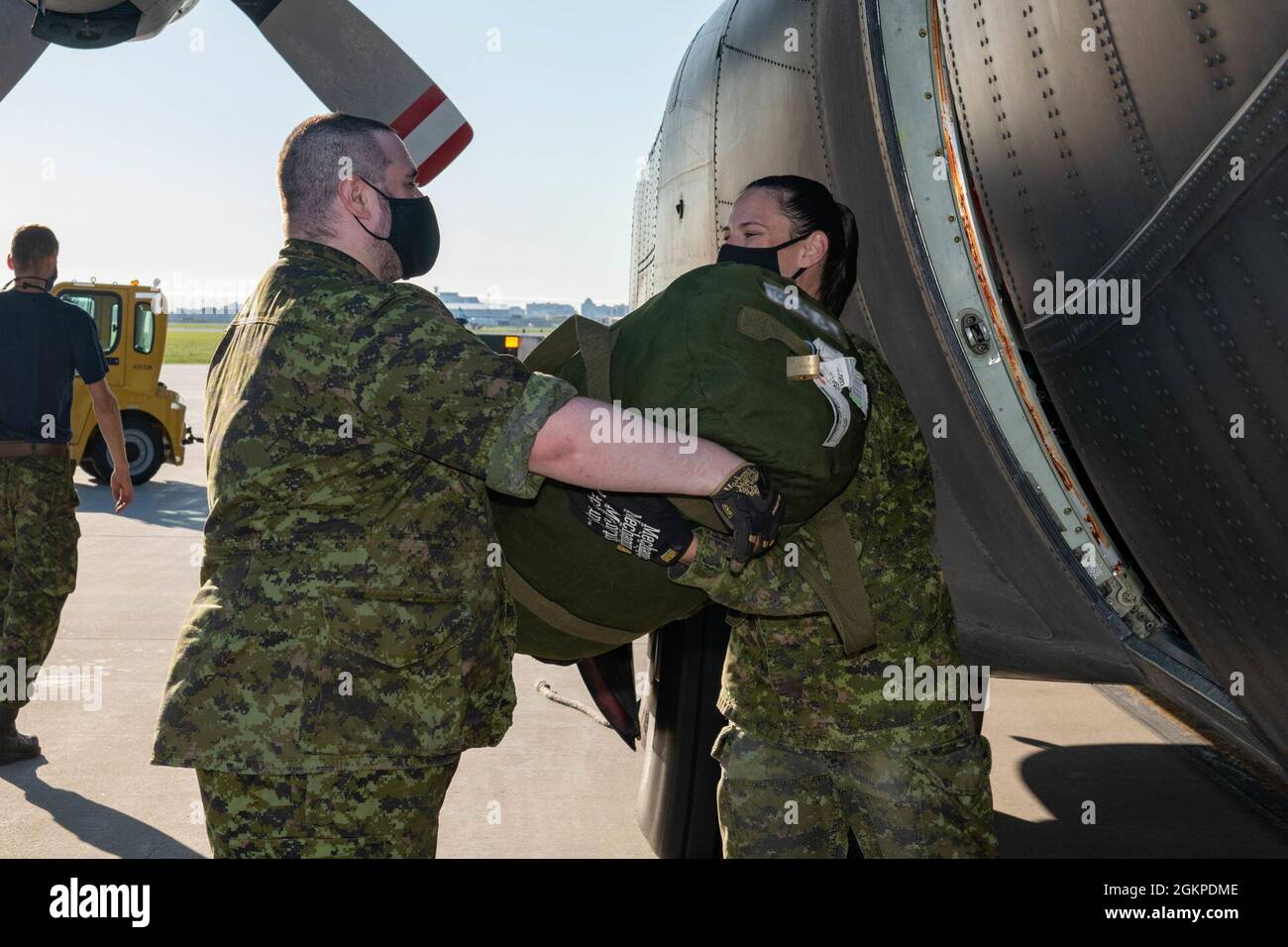 Royal Canadian Air Force members of 17 Mission Support Squadron load a ...