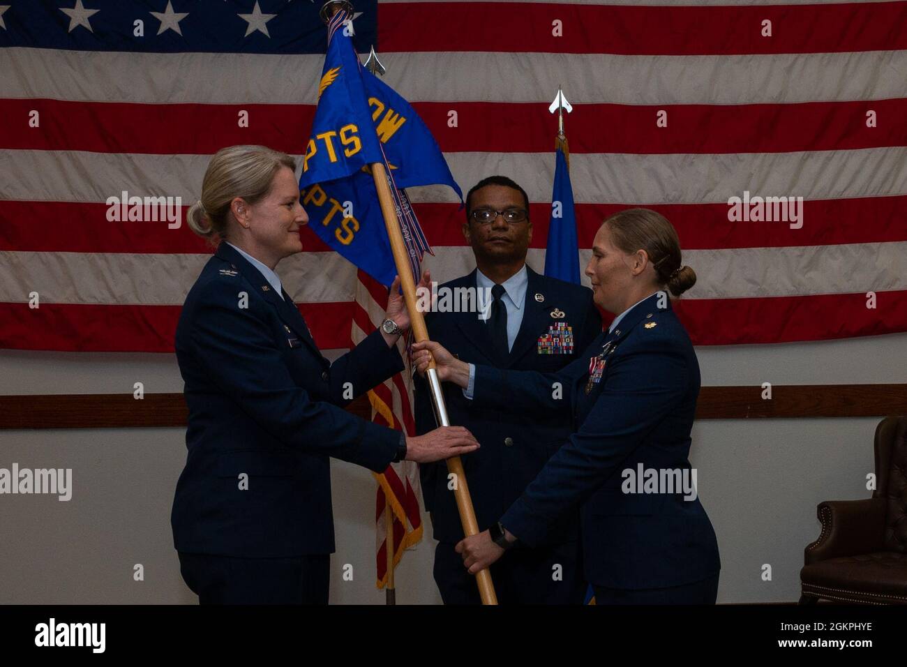 U.S. Air Force Maj. Lisa Kempker, 1st Special Operations Comptroller Squadron commander, passes