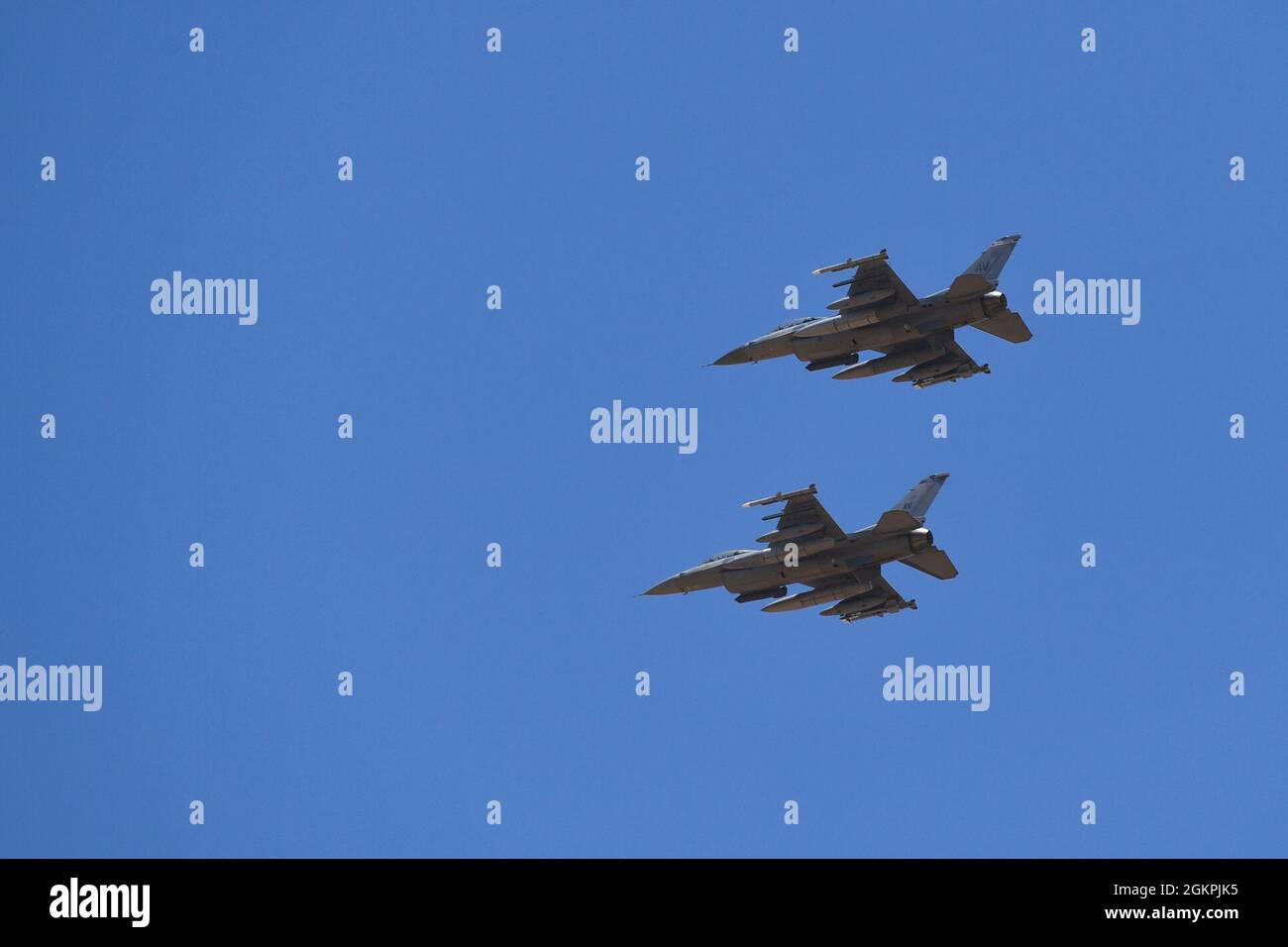 U.S. Air Force F-16 Fighting Falcons assigned to the 510th Fighter Squadron fly over Ben Guerir Air Base, Morocco, 14 June, 2021, in support of African Lion 2021. African Lion is a critical opportunity for members of the joint team to build and test their strategic readiness to deploy, fight and win in a complex, multi-domain environment.  African Lion is U.S. Africa Command’s largest, premier, joint, annual exercise hosted by Morocco, Tunisia and Senegal, 7-18 June. More than 7,000 participants from nine nations and NATO train together with a focus on enhancing readiness for U.S. and partner Stock Photo