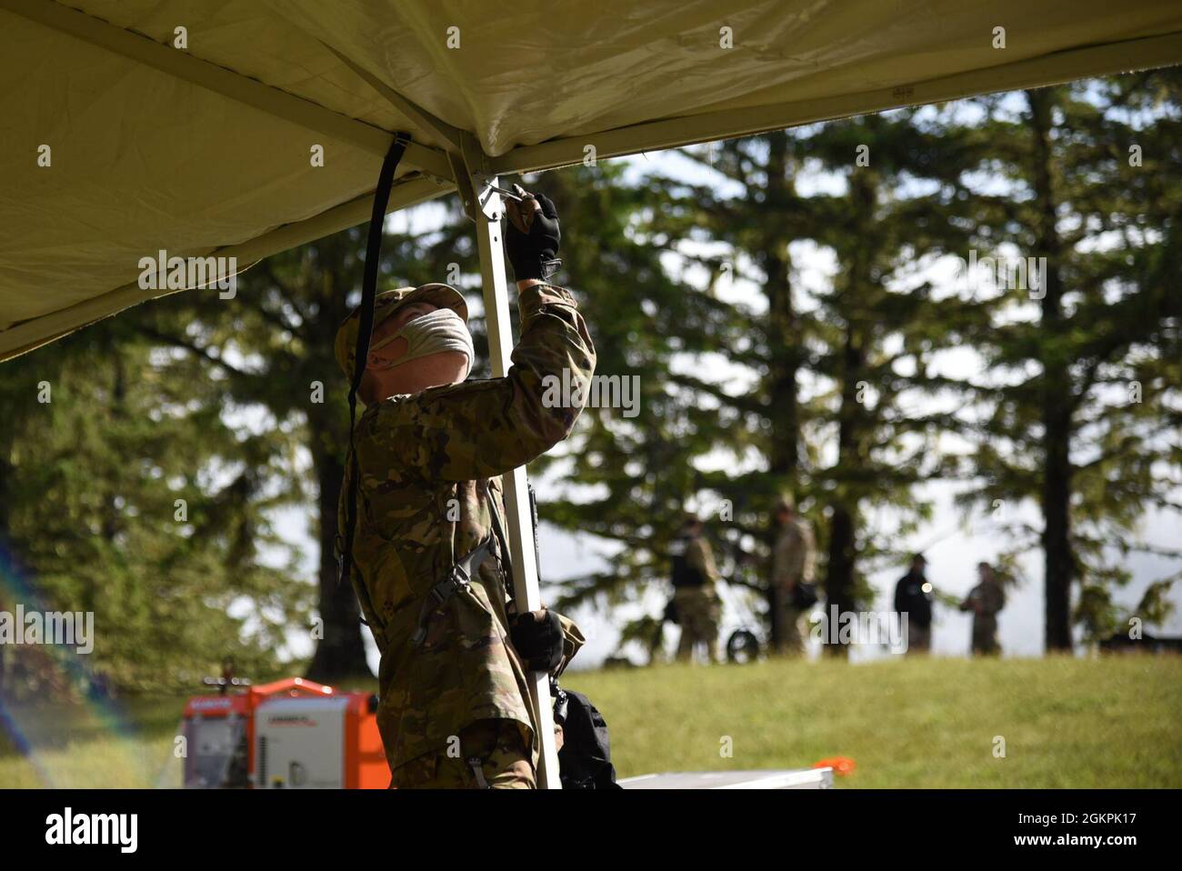 Airmen from the 142nd Force Support Squadron pitch a Tent Extendable Modular Personnel (TEMPER) tent to serve as their base of operations as participants of the Rogue One ExEval. An ExEval is an inspection conducted by the Joint Interagency Training and Education Center every two years, and is designed to measure the Chemical, Biological, Radiological, Nuclear and Explosive (CBRNE) Enhanced Response Force Package (CERFP) team’s ability to respond to a natural or human caused disaster. Rogue One is the first CERFP ExEval conducted since the Covid-19 lockdown began in early 2020. Stock Photo